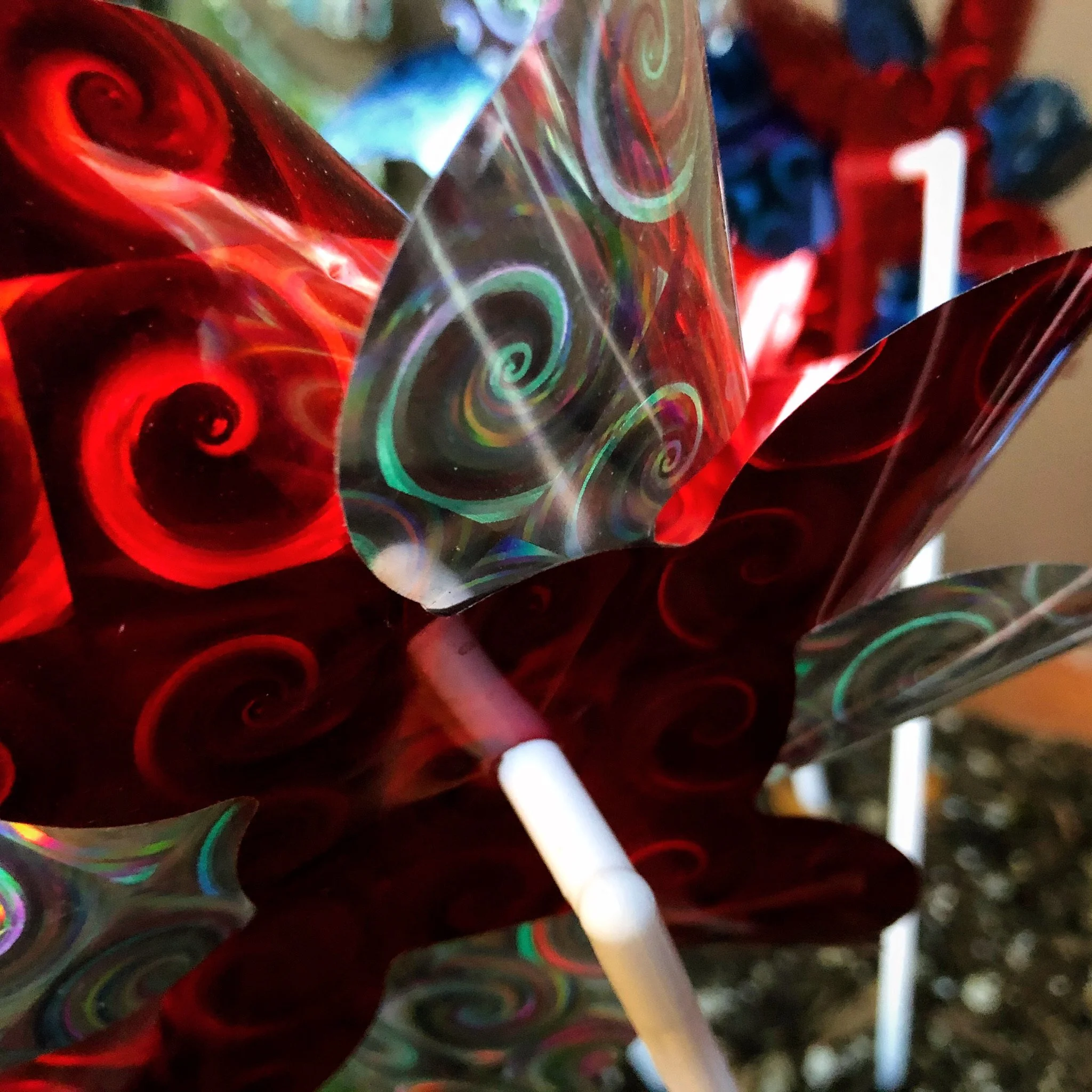 Close-up of colorful swirled glass and plastic decorative sticks.