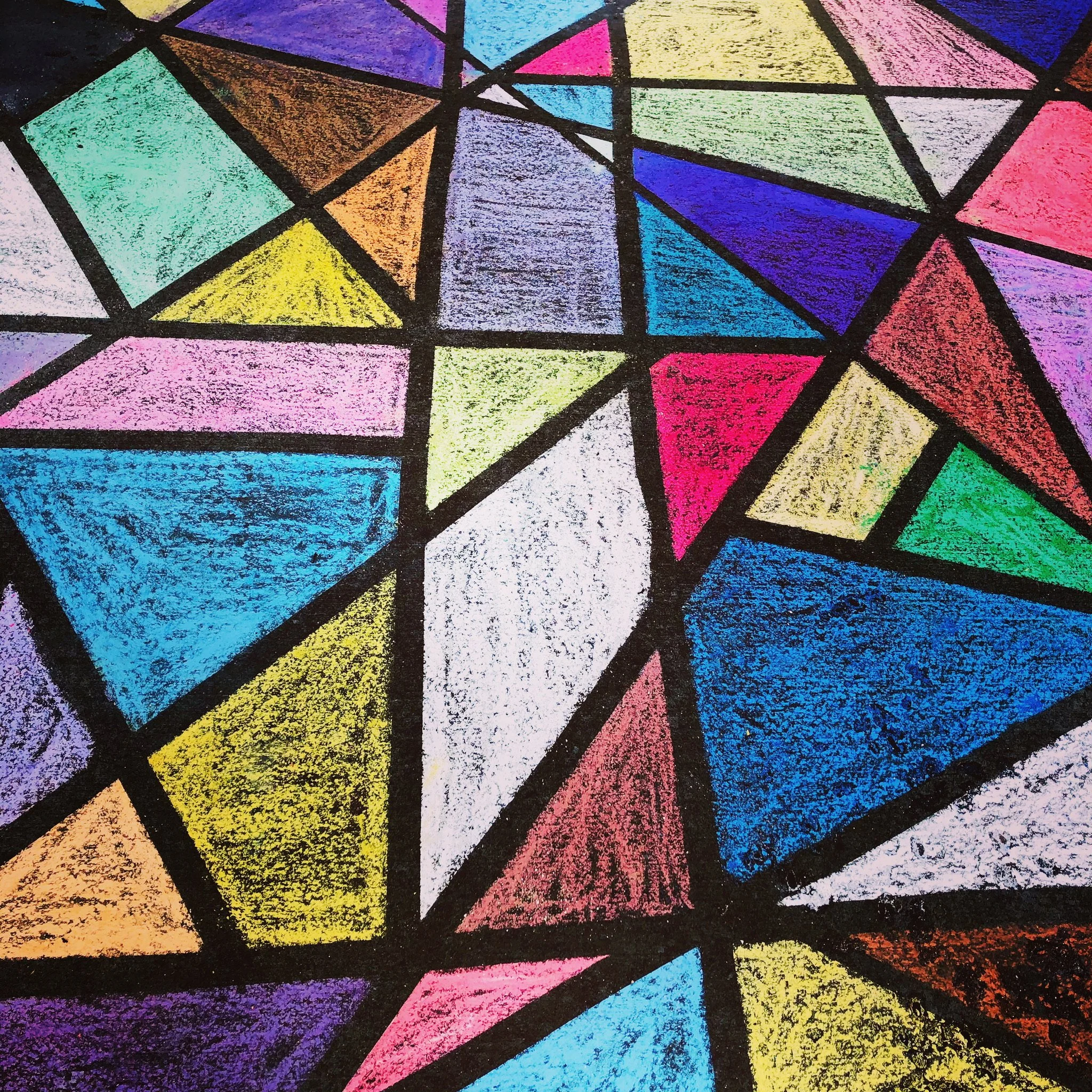 Colorful geometric stained glass window or mosaic pattern with various shapes filled with bright colors like pink, blue, yellow, green, purple, orange, and red, outlined with bold black lines.