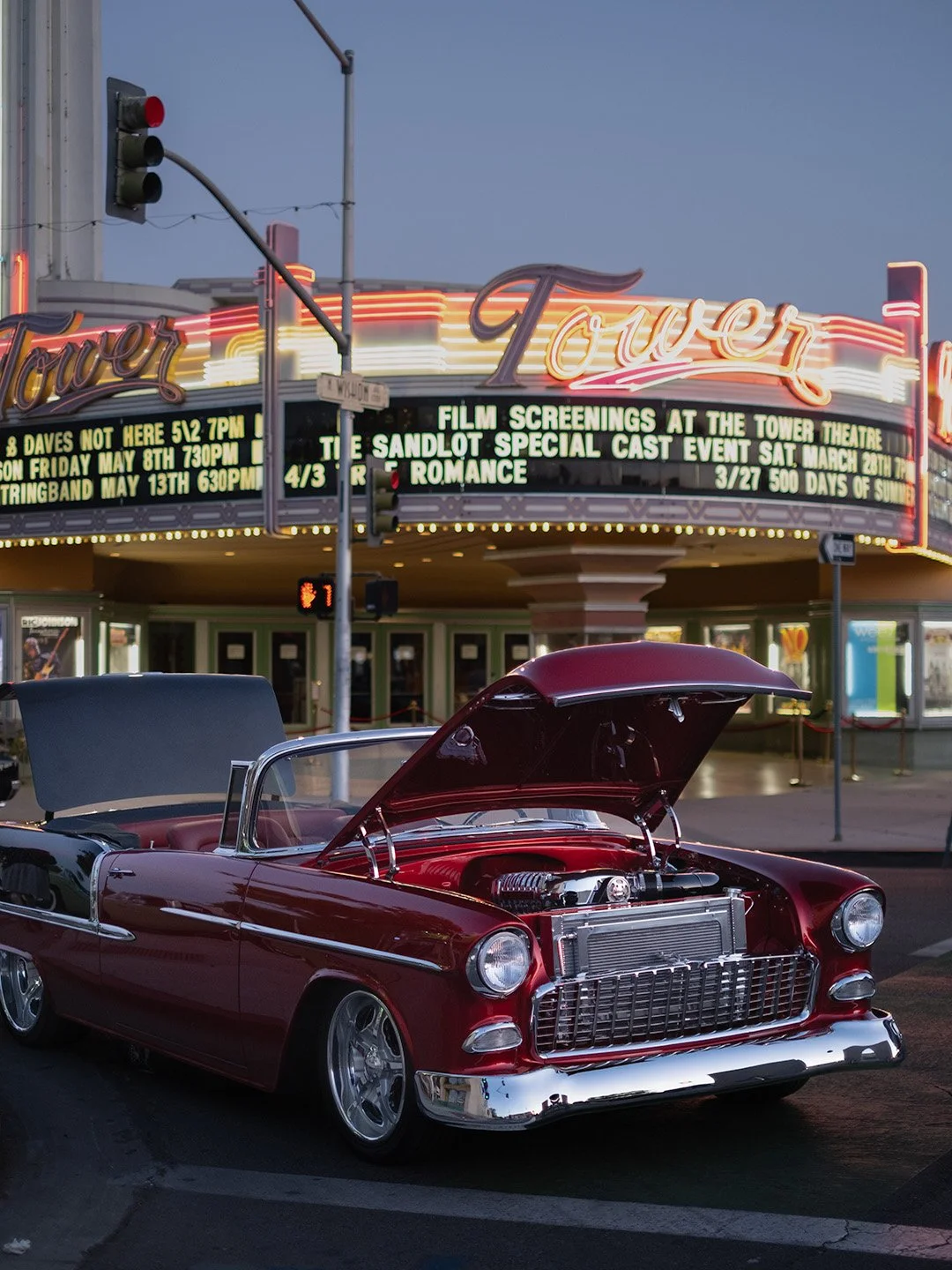 car in front of tower theatre