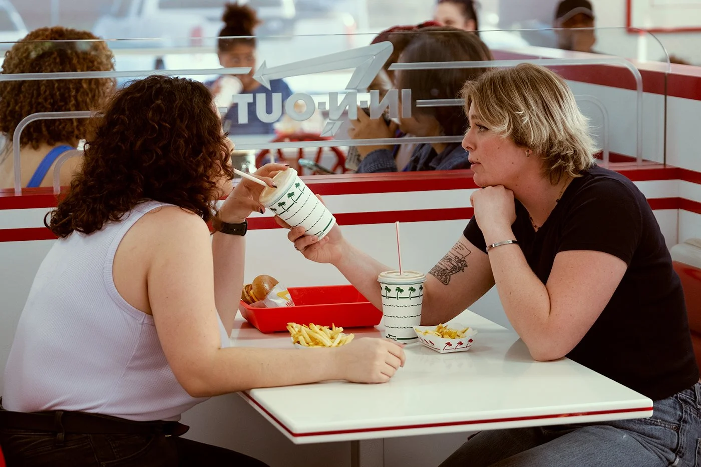 people sharing drink