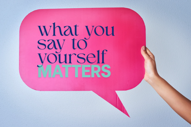 Person holding a pink speech bubble with the text 'what you say to yourself MATTERS' in purple and green letters.