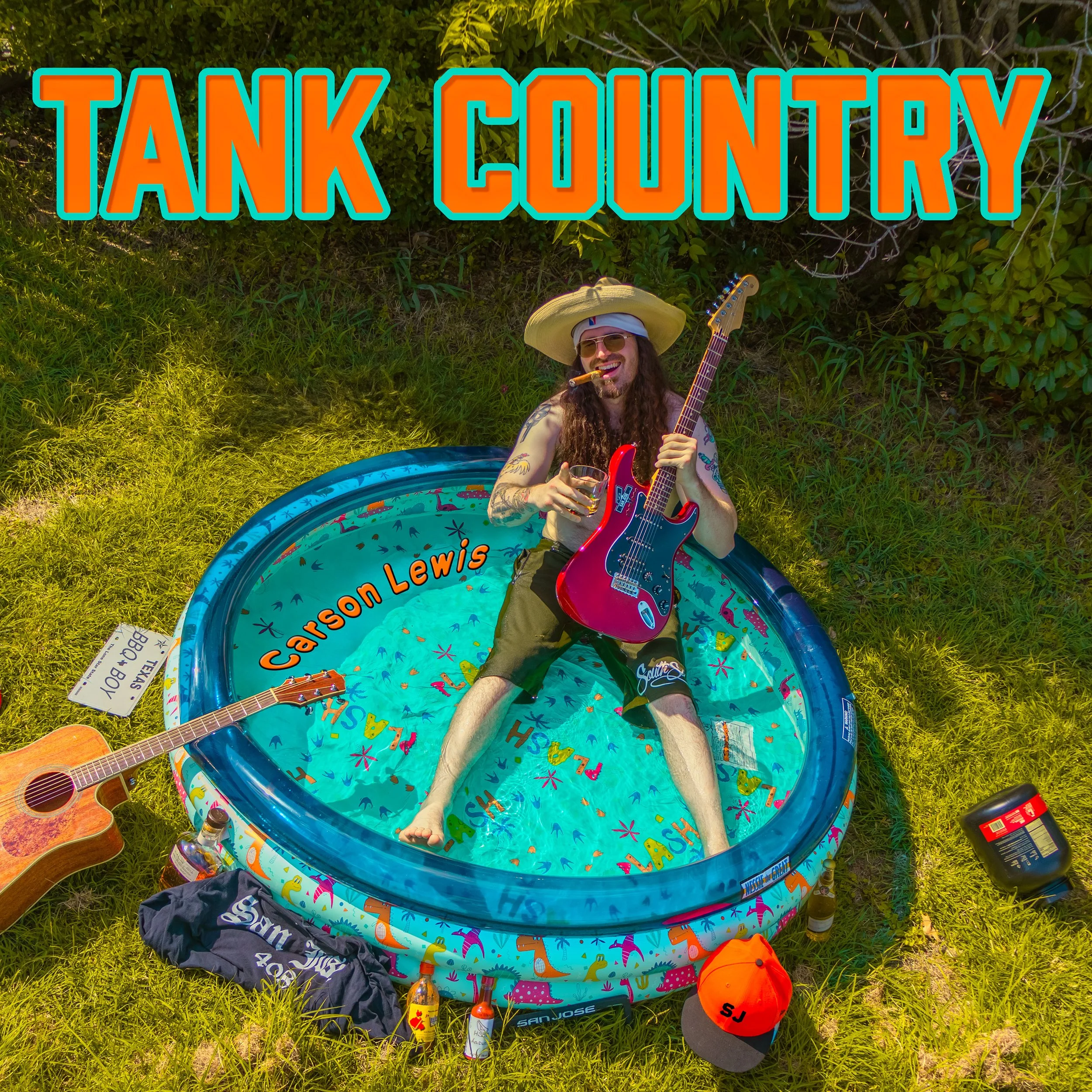 A man with long hair, tattoos, sunglasses, and a straw hat is sitting in a small inflatable pool, holding a red electric guitar, with a drink in his other hand. Surrounding him are guitars, bottles, and a hat, with a background of green grass and bushes. The image has the text 'TANK COUNTRY' at the top and 'Carson Lewis' inside the pool.