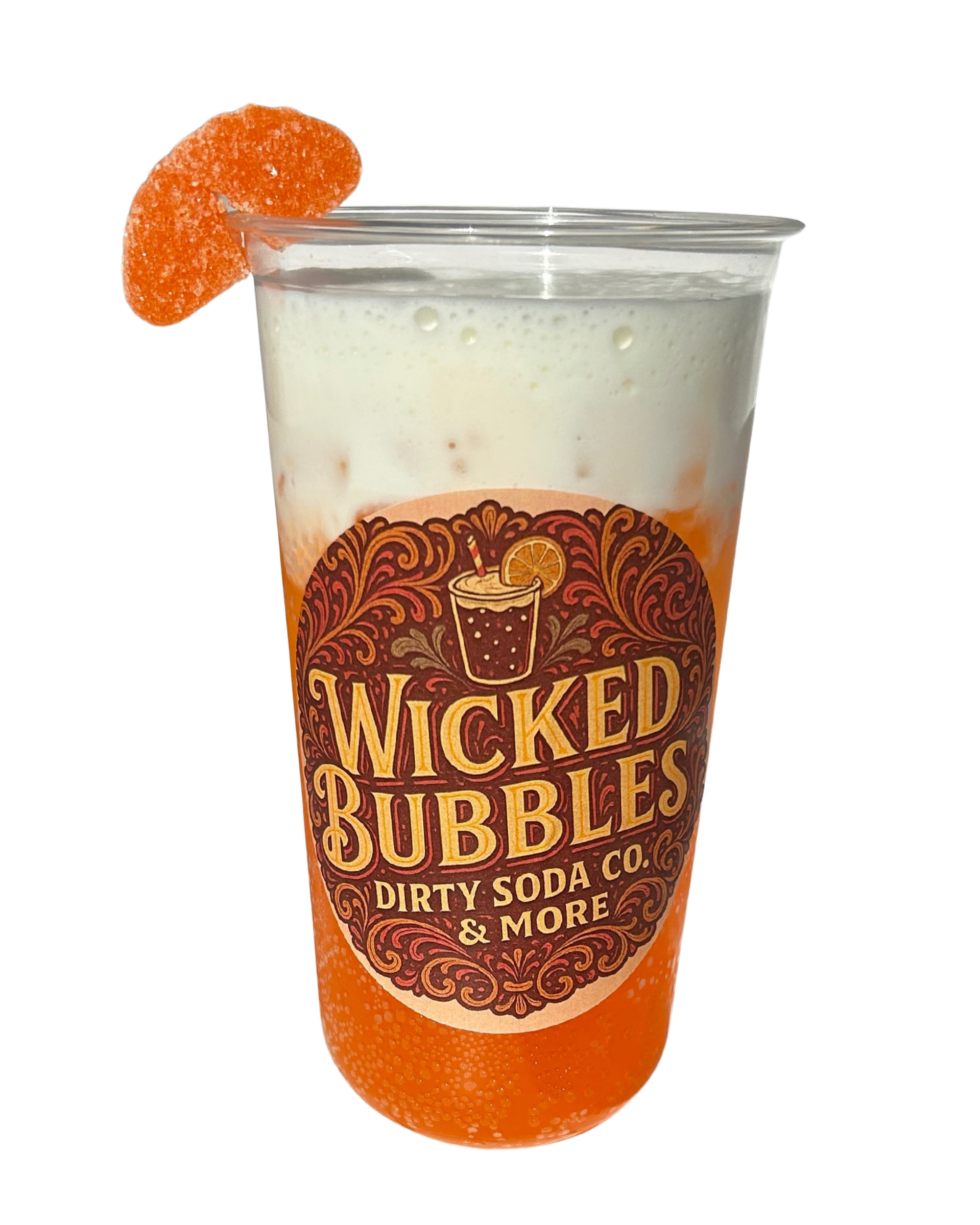 A clear plastic cup filled with an orange and white layered soda drink, with a branded logo that says "Wicked Bubbles Dirty Soda Co. & More," and garnished with an orange gummy candy on the rim.