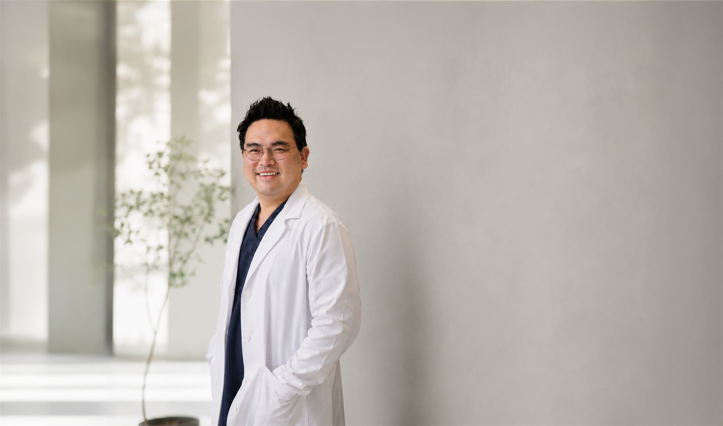 Dr. Joseph S. Kim in a warm, contemporary Smile Plant setting.
