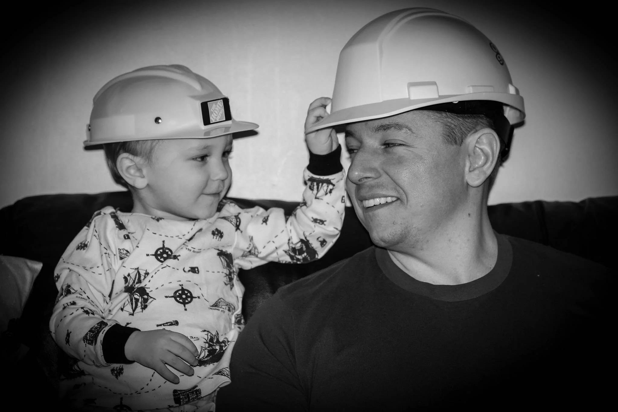 Kirk Kendall wearing a matching hat with a child