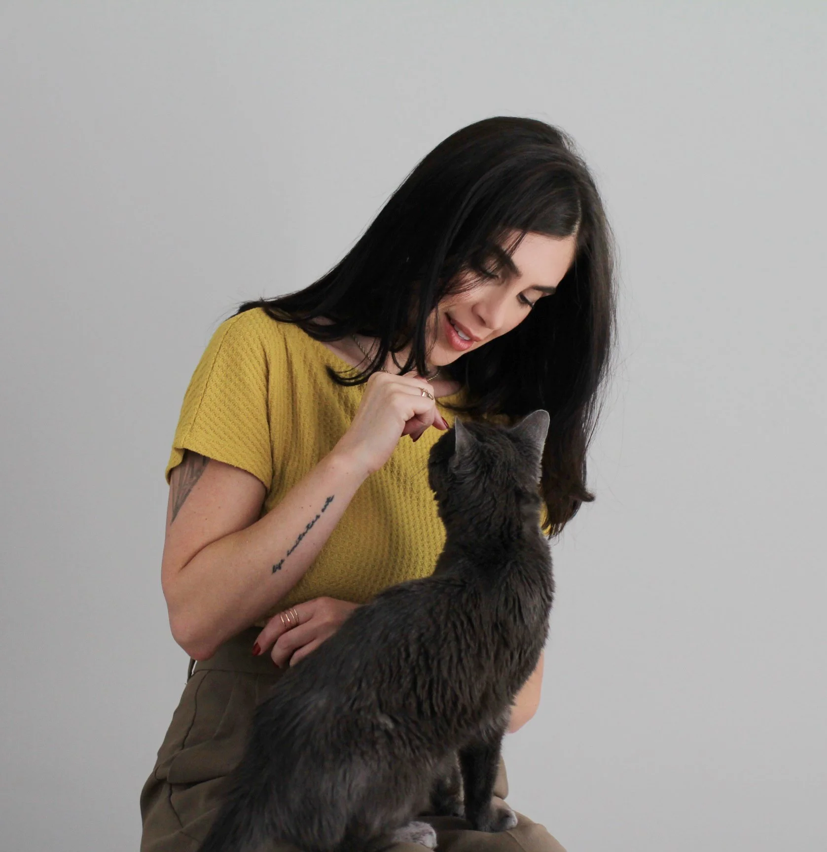 Desiree Polonis, LCSW, with her cat, reflecting warmth, authenticity, and a compassionate approach to online therapy.