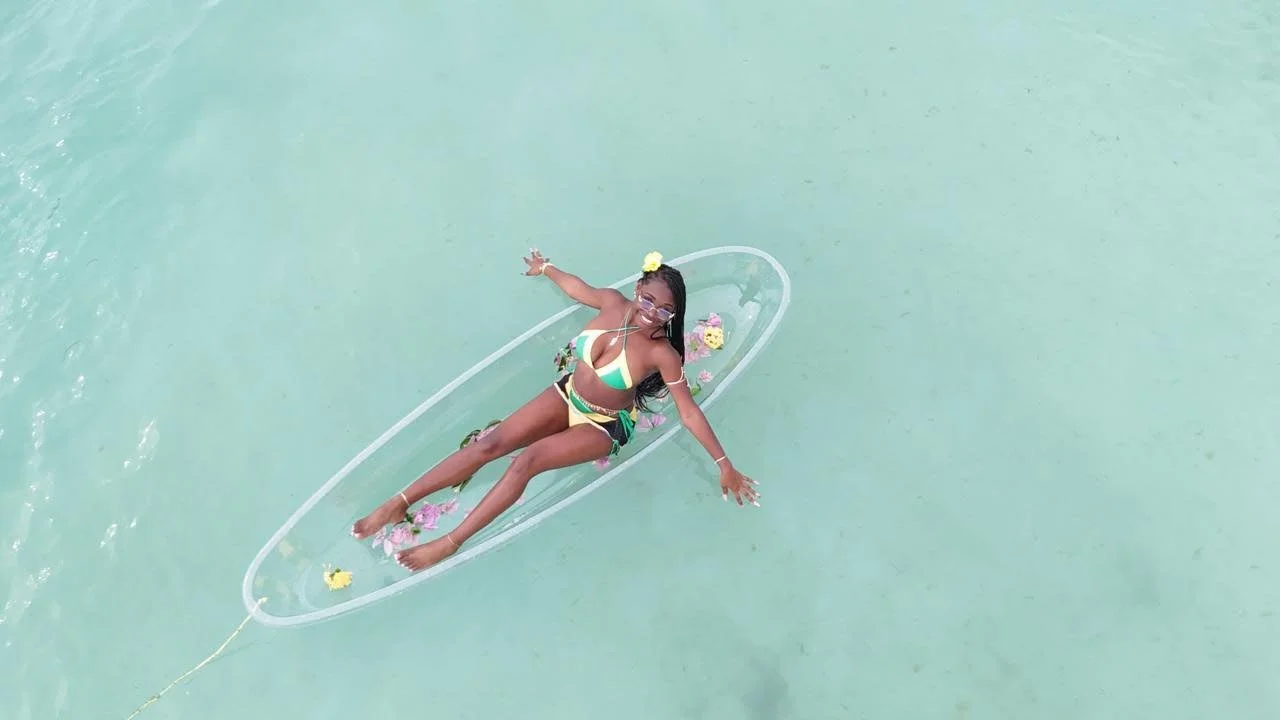 woman doing a photoshoot on the 7 mile beach in Negril Jamaica