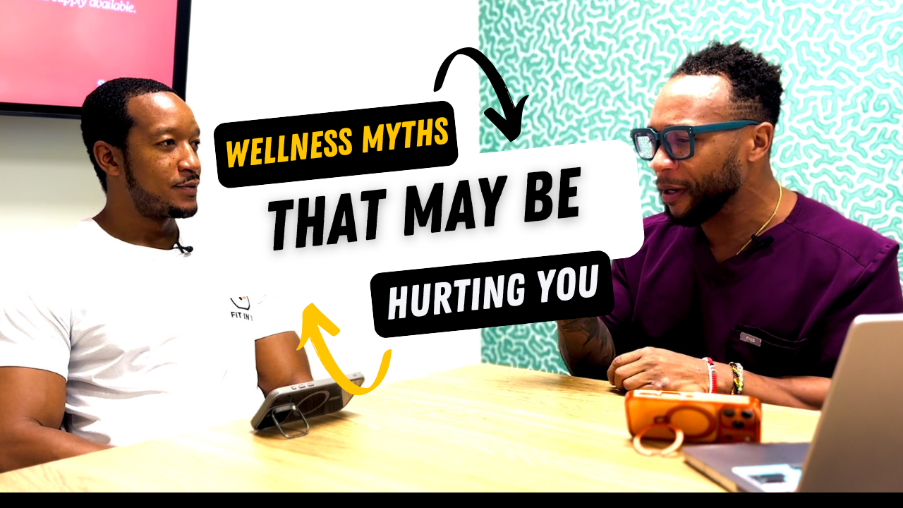 Two men sitting at a table, engaged in conversation, with a graphic overlay that reads 'Wellness Myths That May Be Hurting You'.