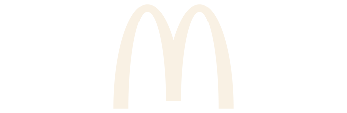 Golden arches of the McDonald's logo on a black background.