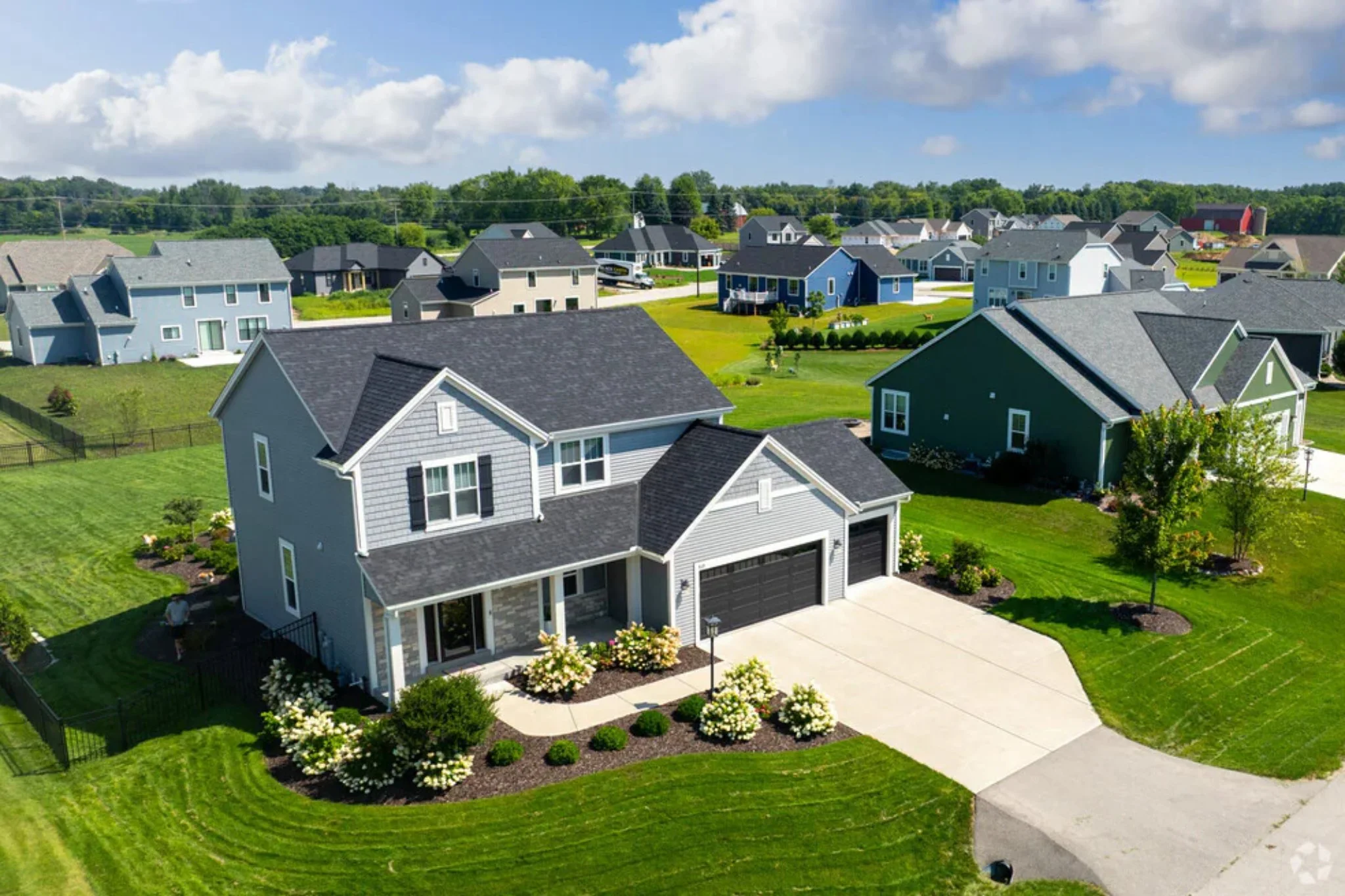 Aerial view of residential homes and neighborhood roof in Dousman, Wisconsin