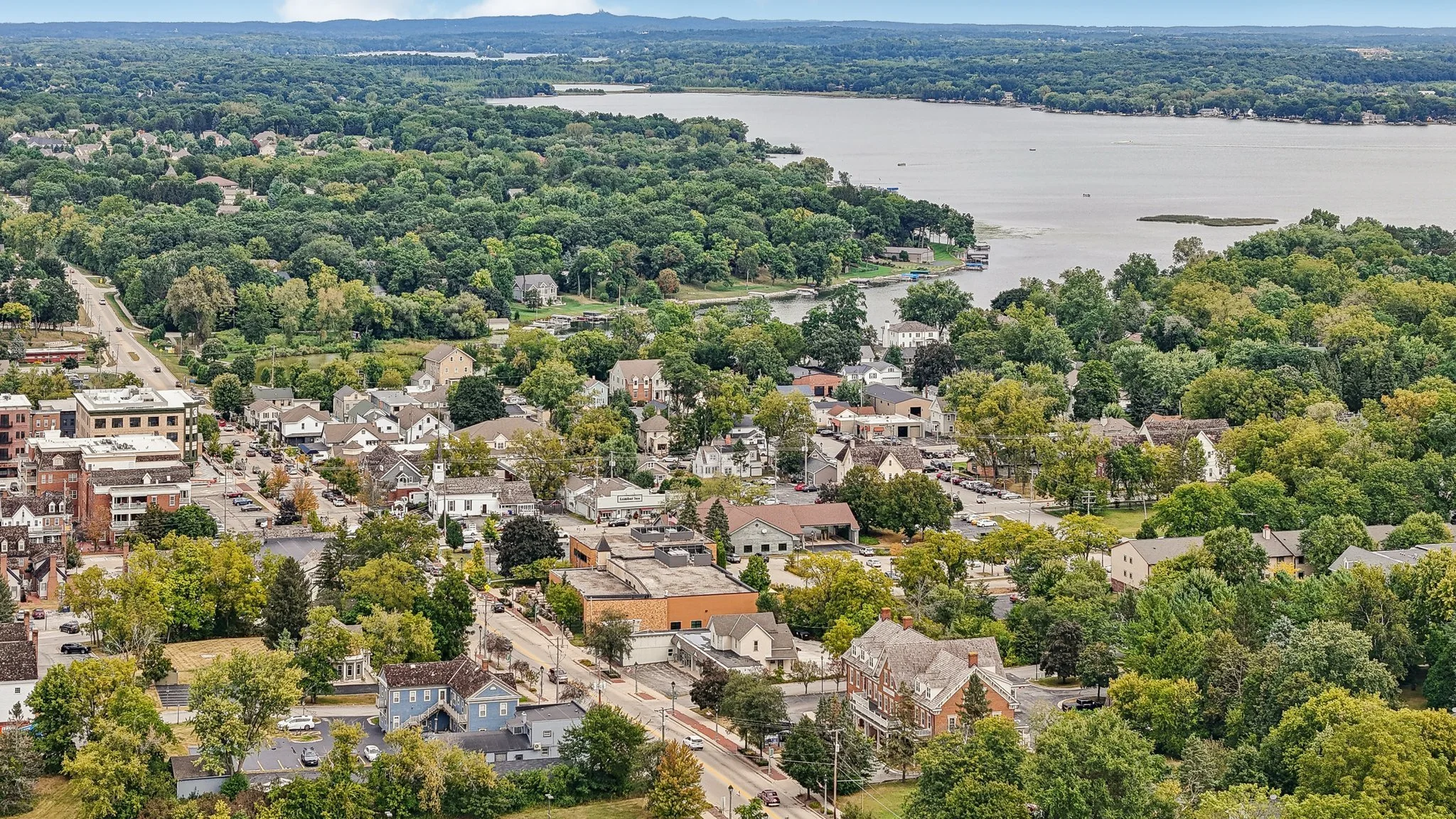 Aerial view of downtown Delafield and surrounding neighborhood roofs in Delafield, Wisconsin