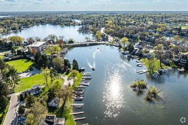 Aerial view of lakes and residential homes and roofs in Nashotah, Wisconsin