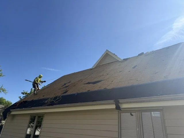 Roofer working on roof