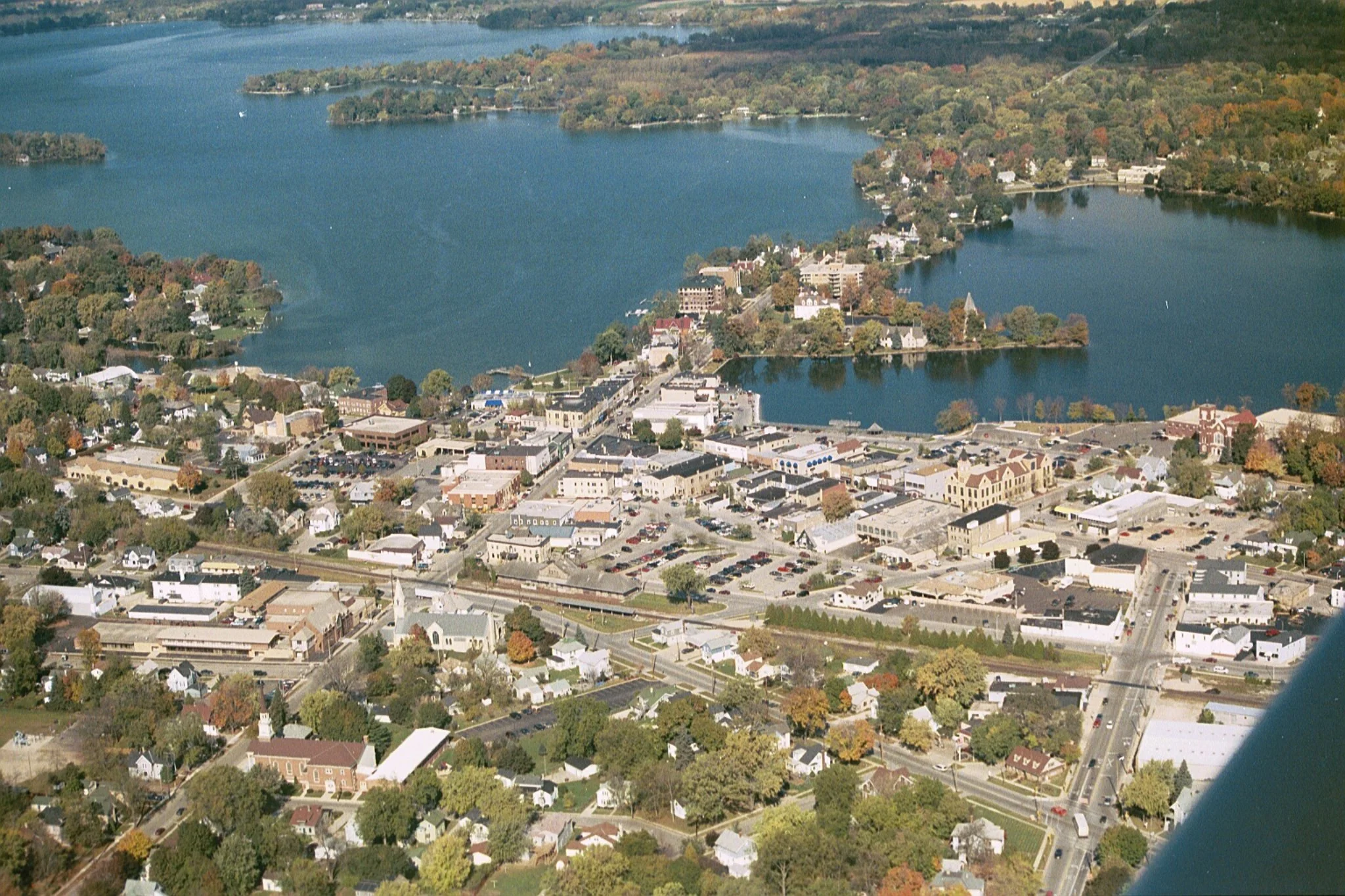 Aerial view of downtown Oconomowoc and surrounding lakes and roofs in Oconomowoc, Wisconsin