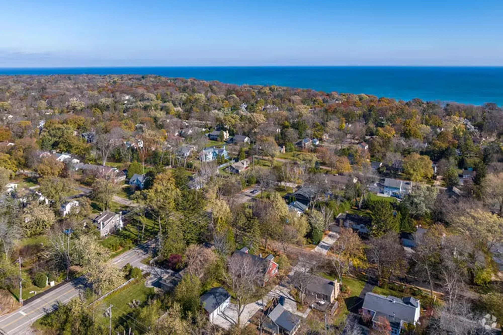 Aerial view of residential neighborhood roofs in Fox Point, Wisconsin near Lake Michigan