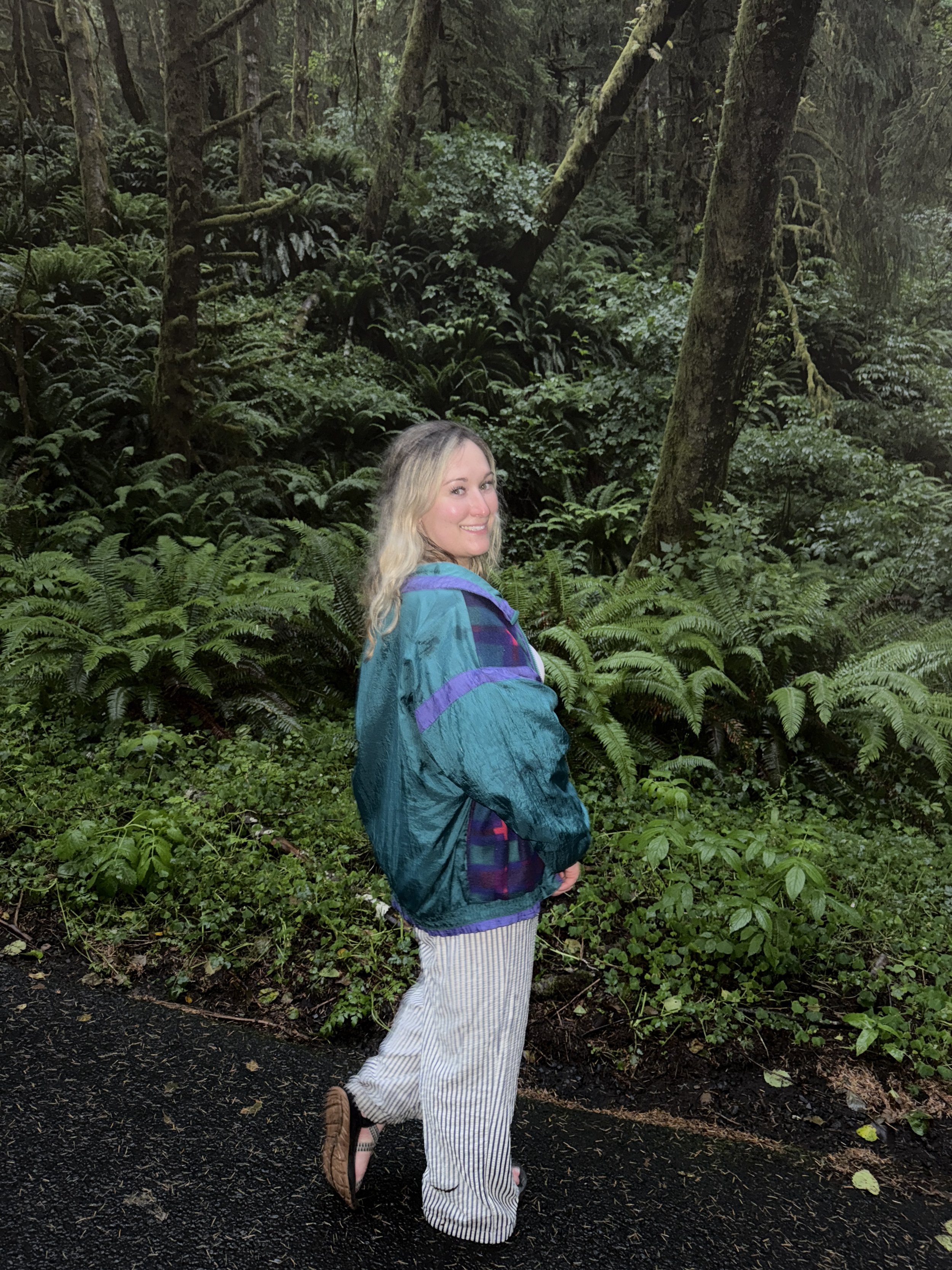 Oregon elopement photographer standing in the forest at Indian Beach along the Oregon Coast.