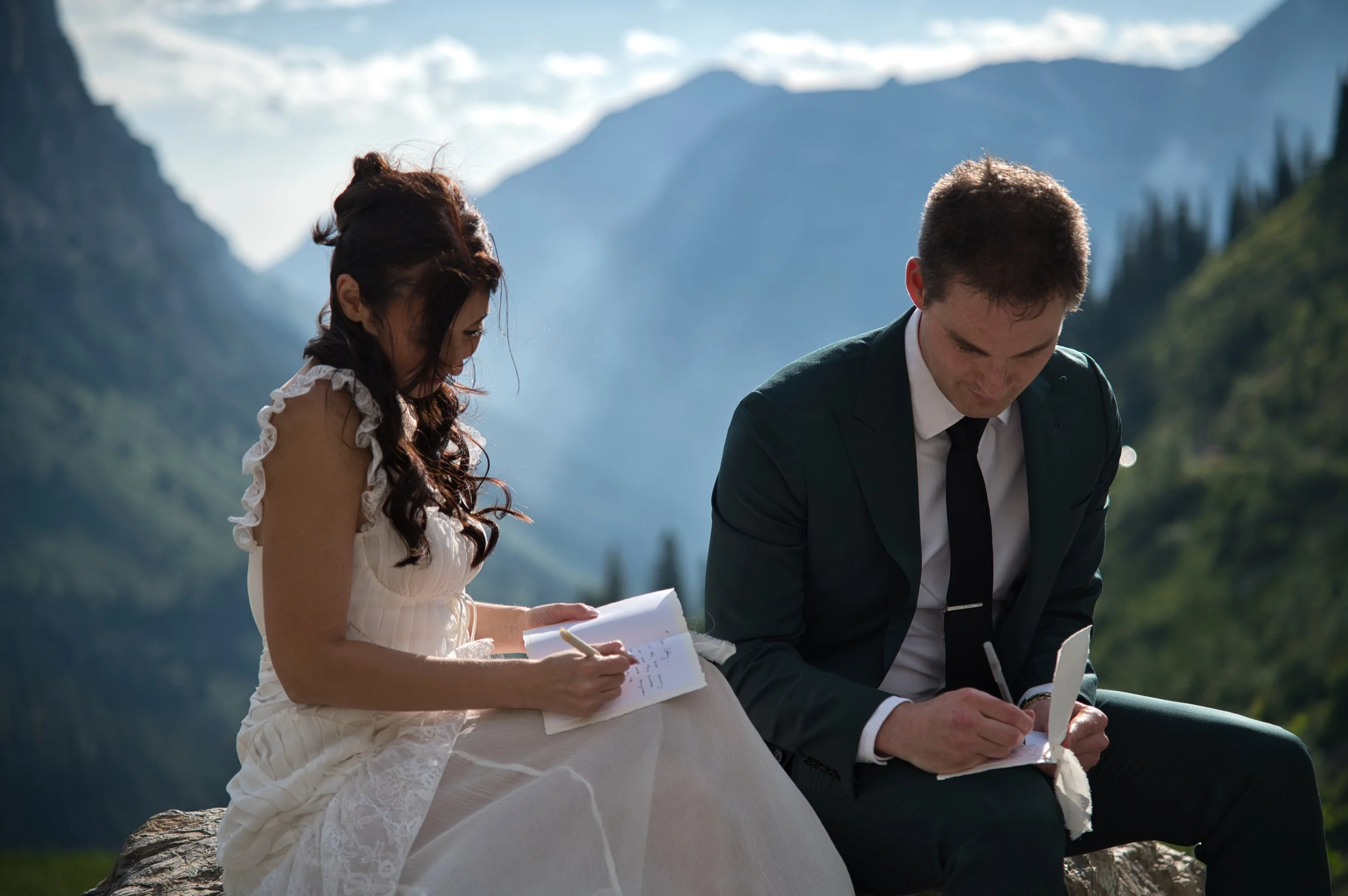 Couple exchanging vows in mountains