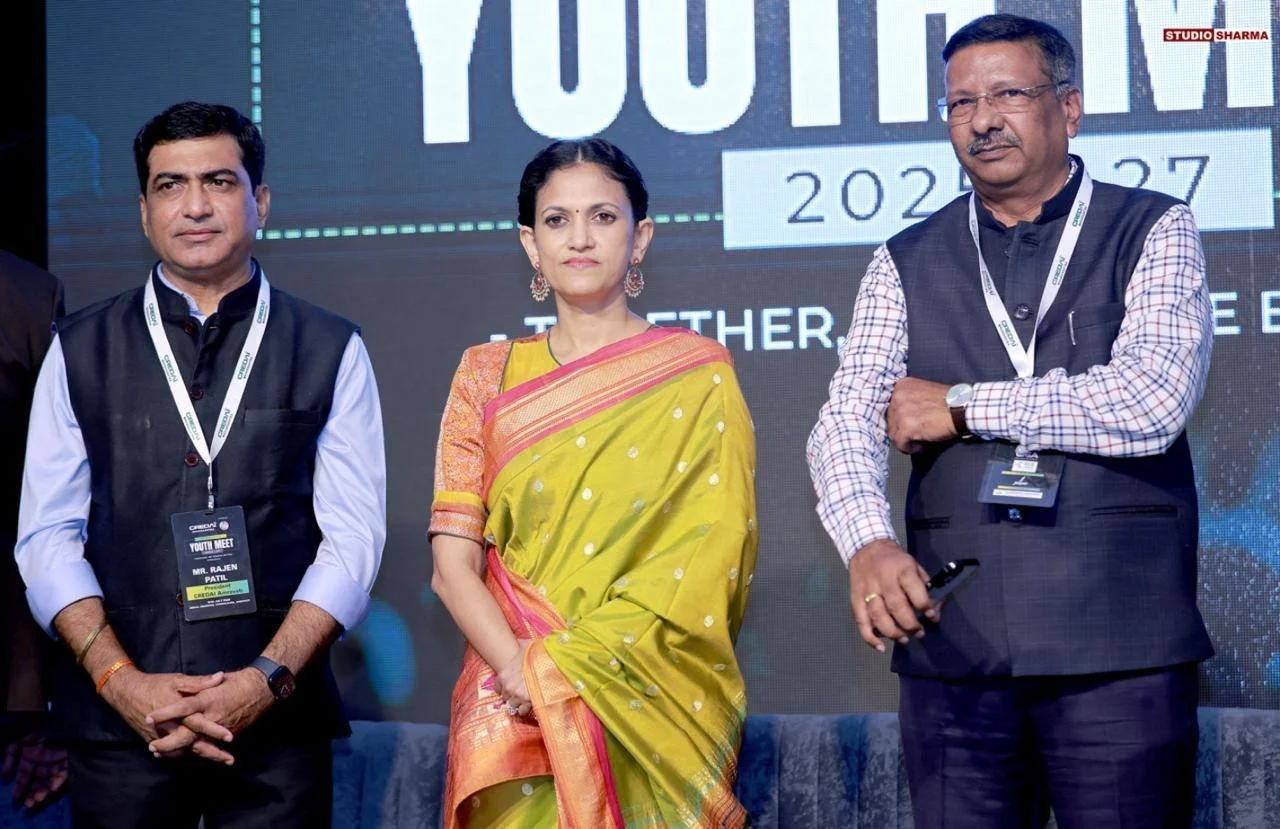 Youth Con by CREDAI Amravati - At chikhaldara. - With President - Rajen Patil them is a large screen displaying text about the event.