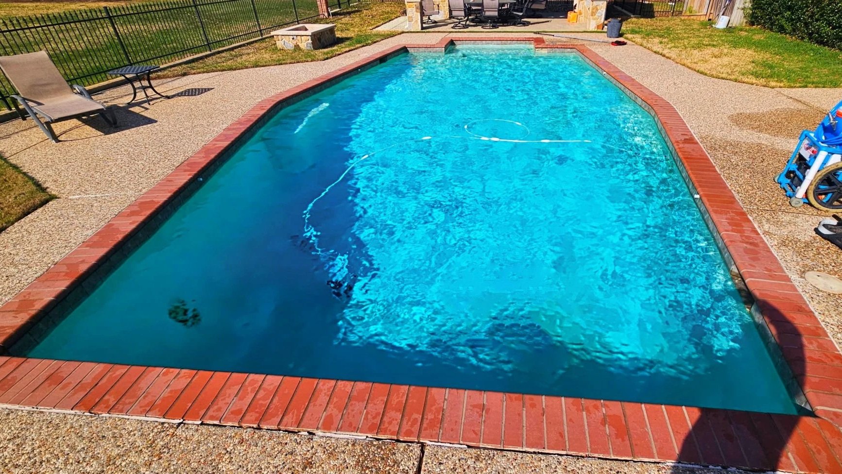 Crystal-clear, professionally maintained pool with sparkling clean water, safe chemical balance, and debris-free surfaces—perfect for relaxation and family fun.