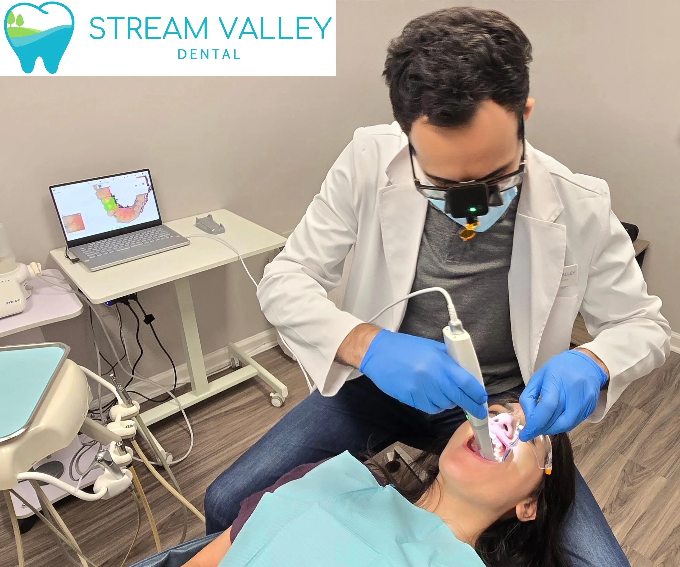Dr. Bakir providing dental care to a patient at Stream Valley Dental