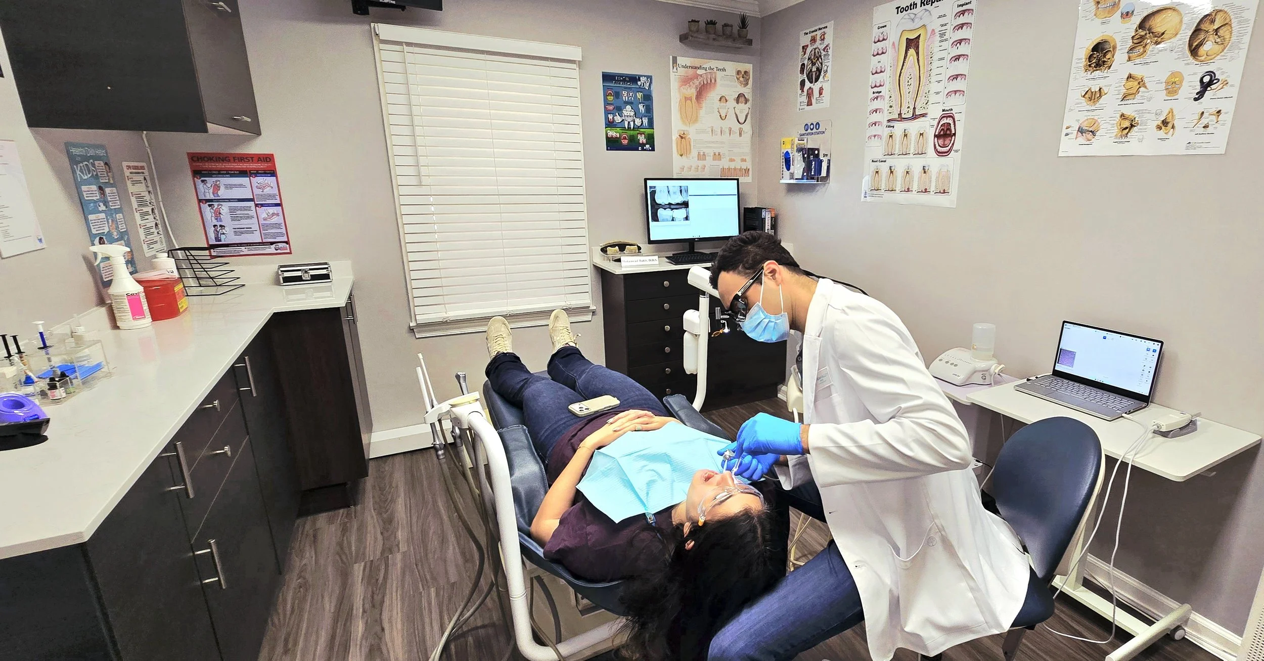Dr. Bakir providing dental care to a patient at Stream Valley Dental