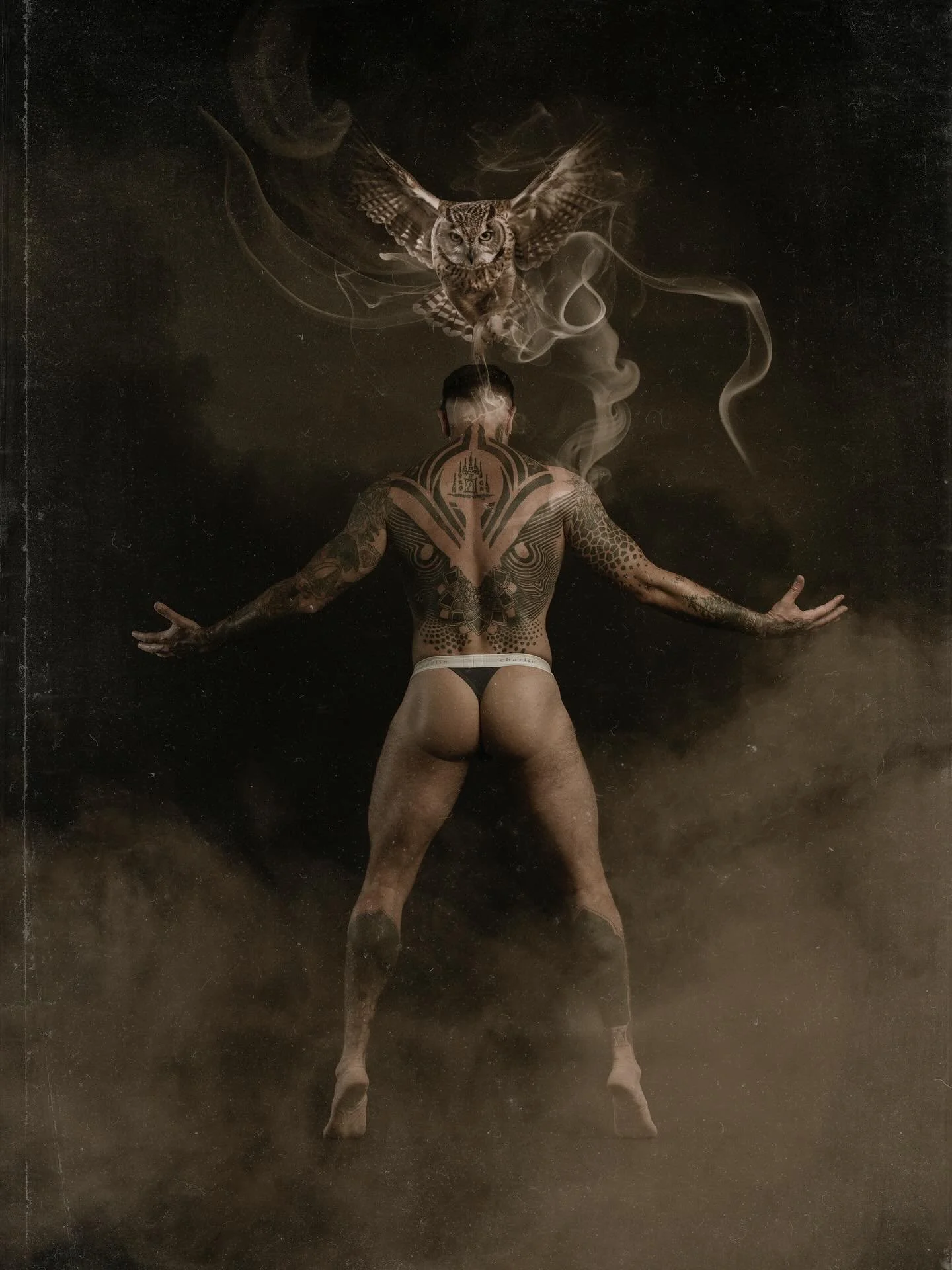 Rise from the shadows.
Eyes sharp. Spirit untamed.
The hunter becomes the hunted.

#ArtModel #DarkArt #MenWithTattoos #QueerArt #MaleMuse #TattooArt #PhotographyArt #OwlSymbolism  #ContemporaryArt #SmokeAndShadow #MysticVibes #BodyArt #TattooCollecto