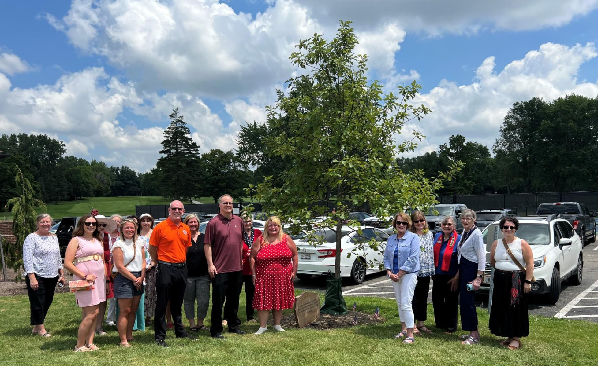 Jacob Gaskins Chapter, NSDAR, and North Canton City officials standing in front of the Liberty Tree at Arrowhead Country Club in honor of Jacob Gaskins