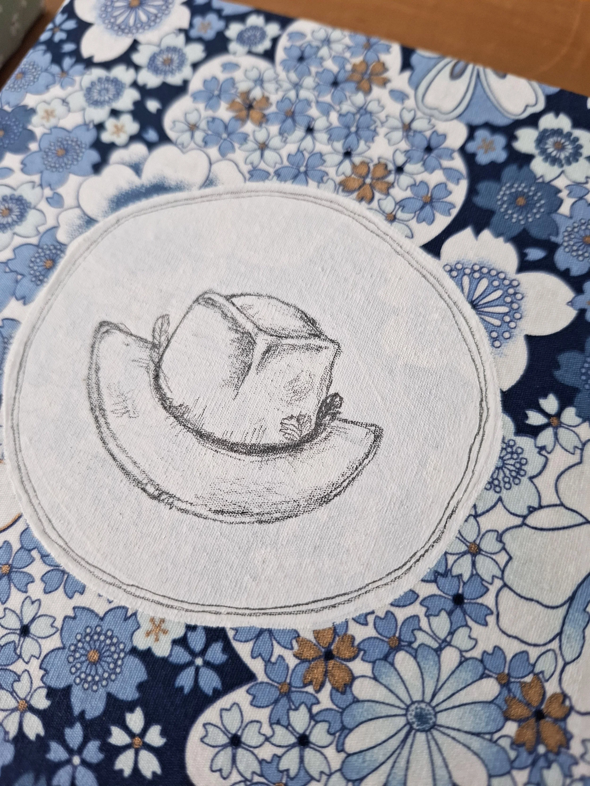 Well worn hat on blue floral - detail.jpg