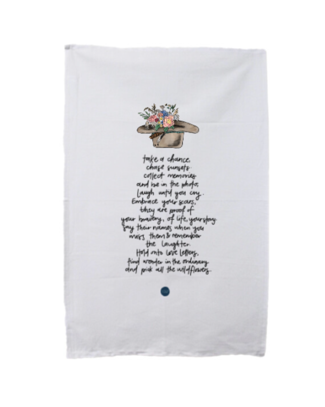 A white tea towel with a drawing of a hat filled with flowers and a handwritten inspirational quote about cherishing memories and embracing scars.