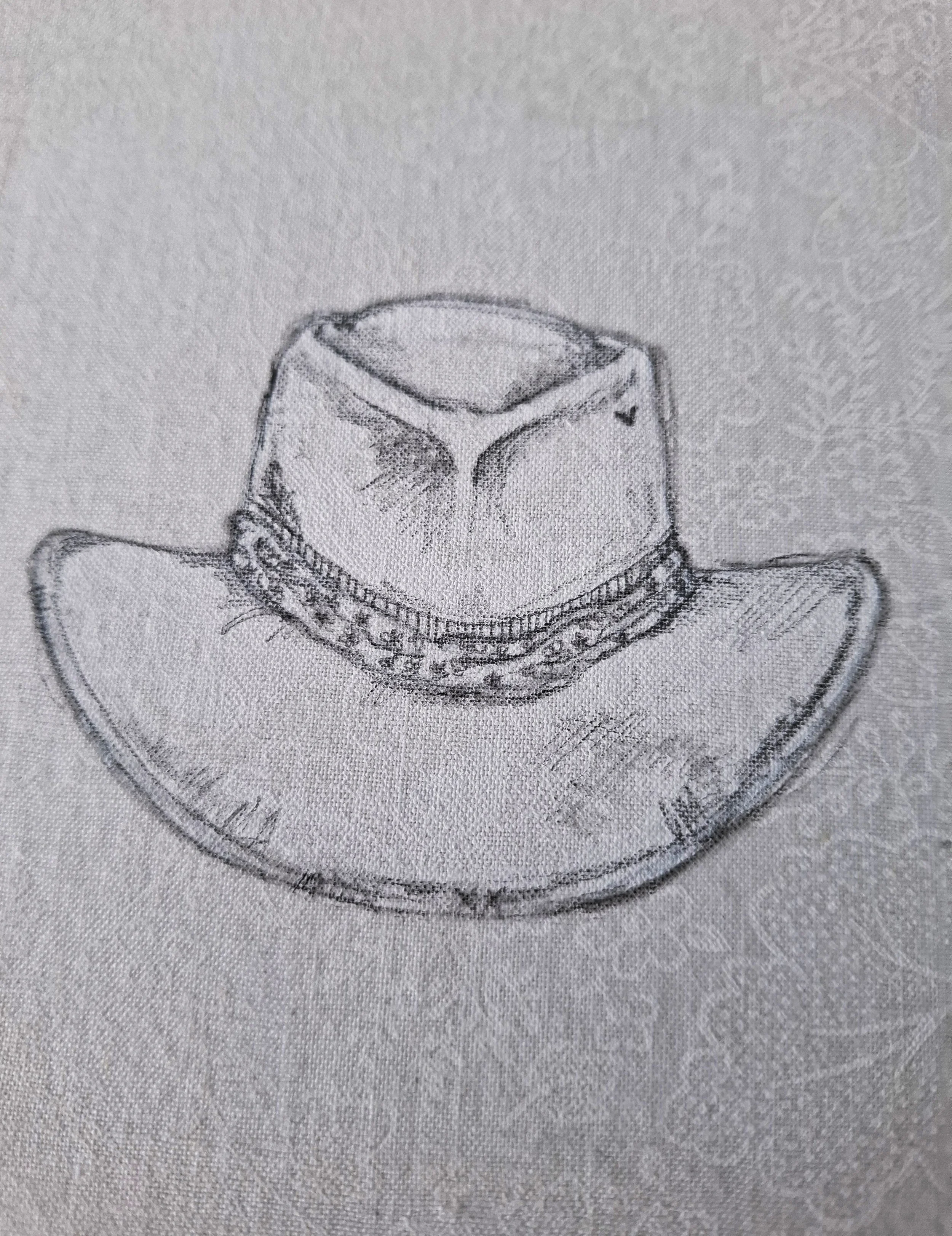 Well worn hat on white fabric - detail.jpg