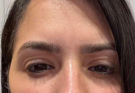 Close-up of a woman's eyes and eyebrows.