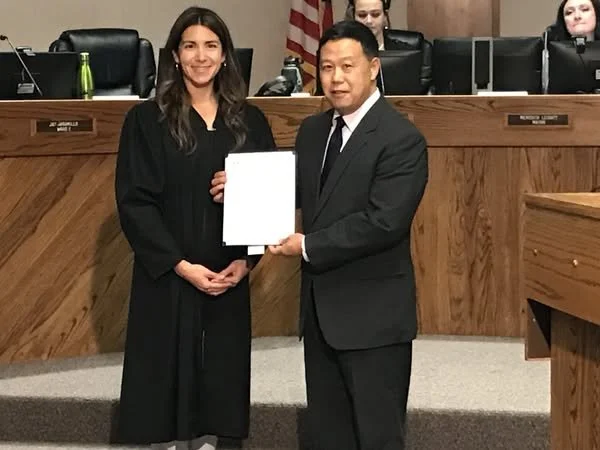 Northglenn Municipal Judge, the Honorable Amanda Bailhache presents Rich Kondo the Oath of Office in 2022.
