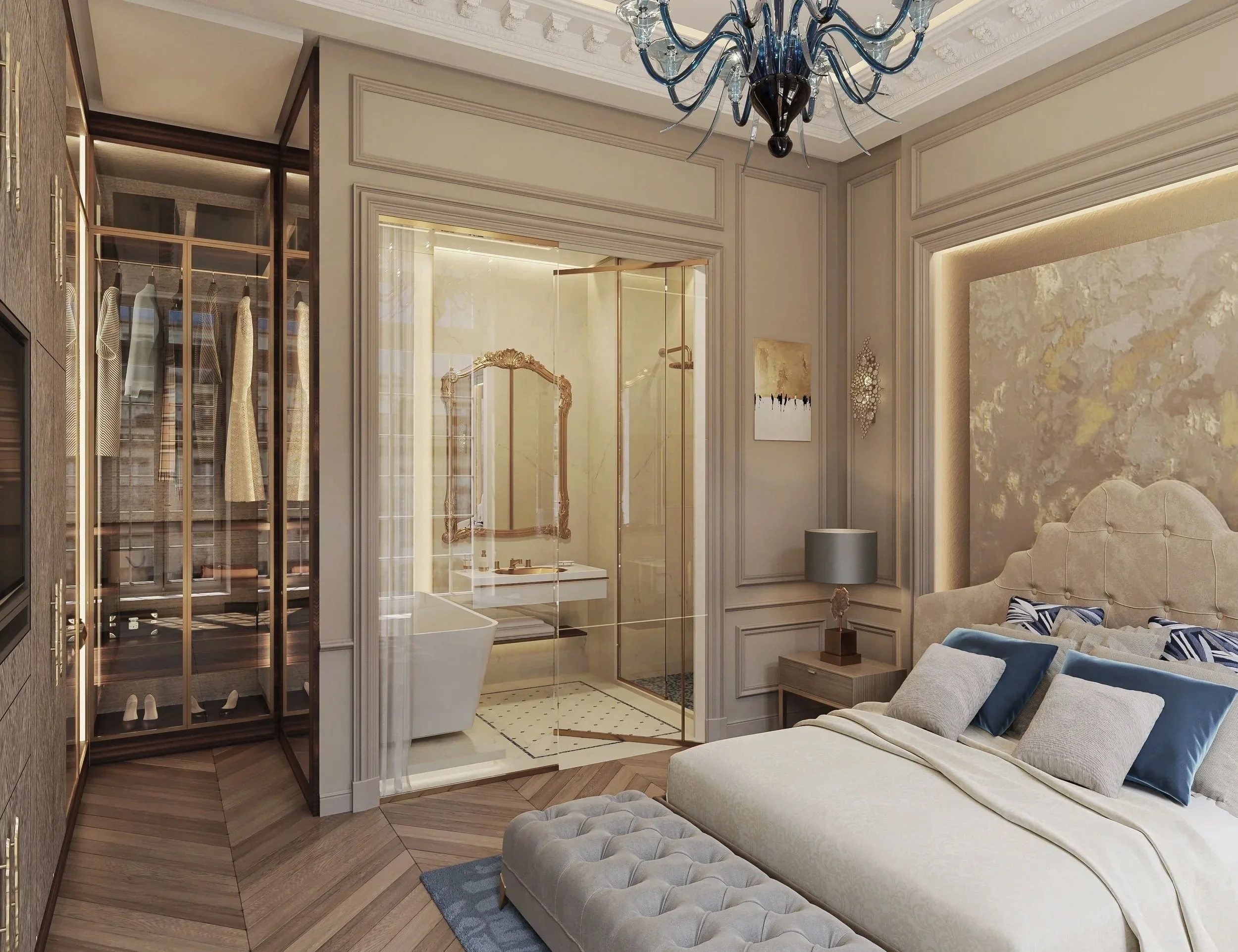 A luxurious bedroom with a beige tufted sofa, pillows, and a ornate chandelier hanging from a decorated ceiling. There is a glass-enclosed shower area with a vintage style mirror and metallic fixtures. The room features a combination of classic and modern decor, with wooden flooring and detailed wall moldings.