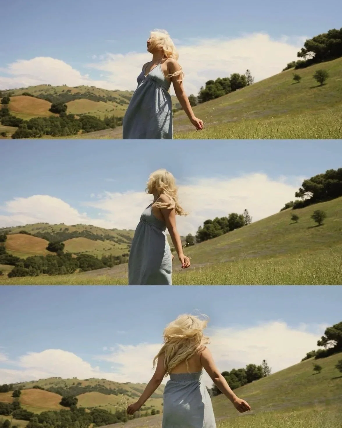 Sequence of three images showing a woman with long blonde hair jumping and spinning in a grassy field near rolling hills, wearing a light blue dress, with a partly cloudy sky overhead.