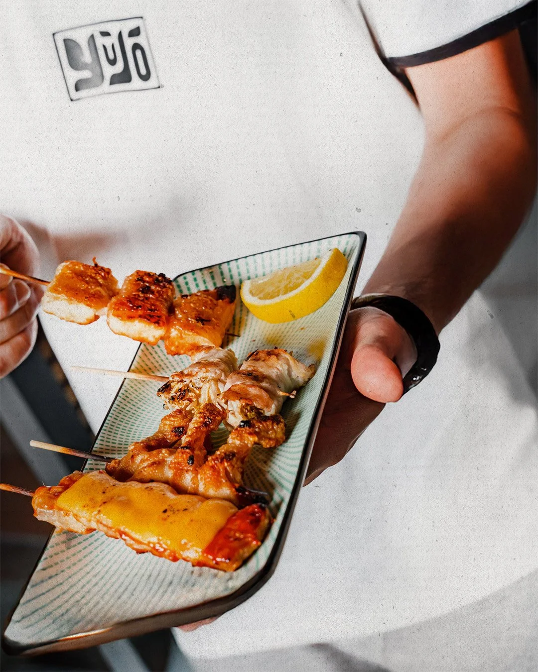 So, what is kushiyaki? 🤔⁠
Simply put: it&rsquo;s the art of the Japanese skewer. Bite-sized pieces grilled over fire, seasoned with smoke, skill, and a whole lot of heart.⁠
⁠
It&rsquo;s food made for sharing, for trying a little of everything, and f