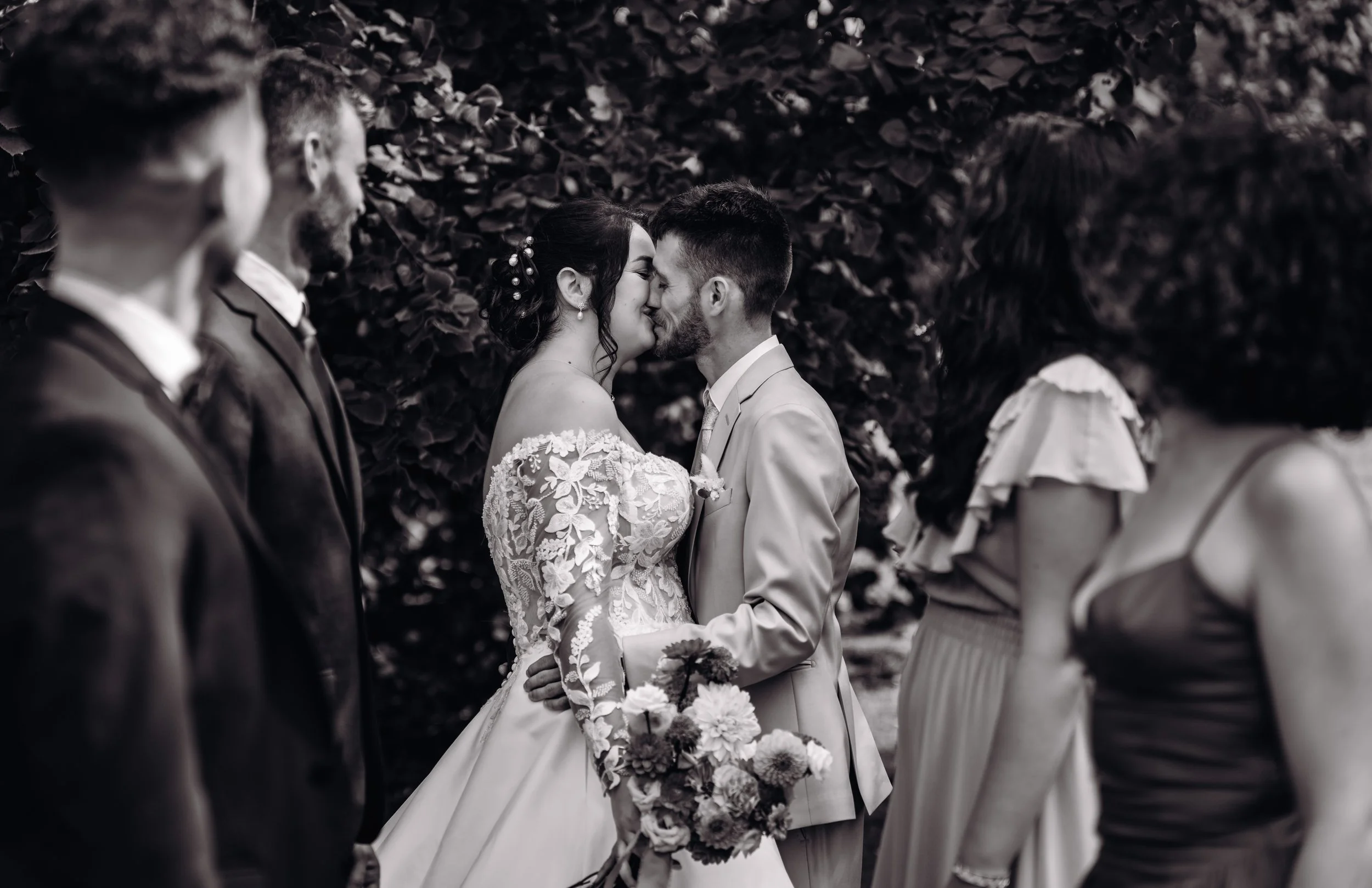 Newlywed couple surrounded by their friend during their french wedding