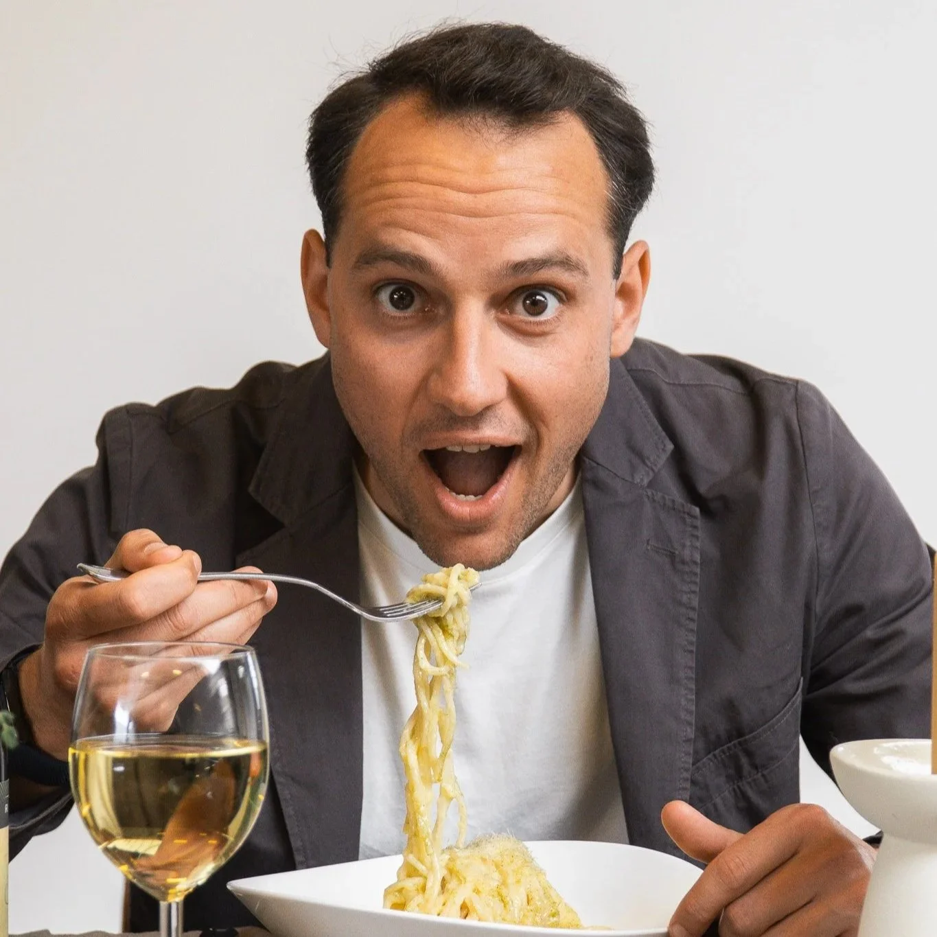 A man eating pasta