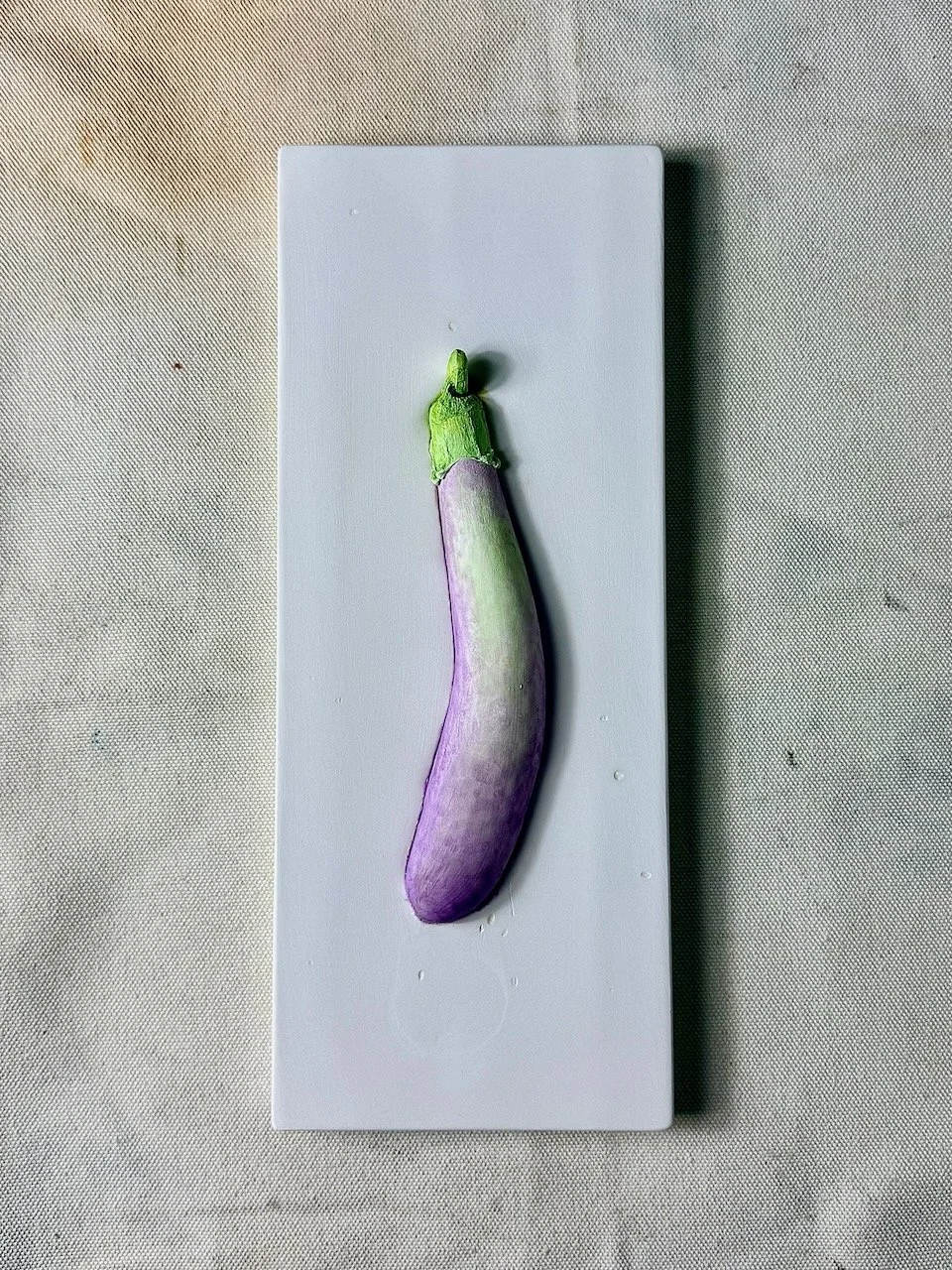 Eggplant coloured wall relief