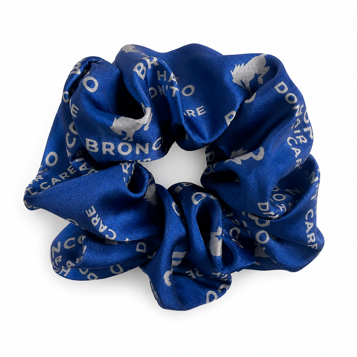 Bronco Hair Don't Care satin scrunchie in royal blue with steel Bronco horse and text print.
