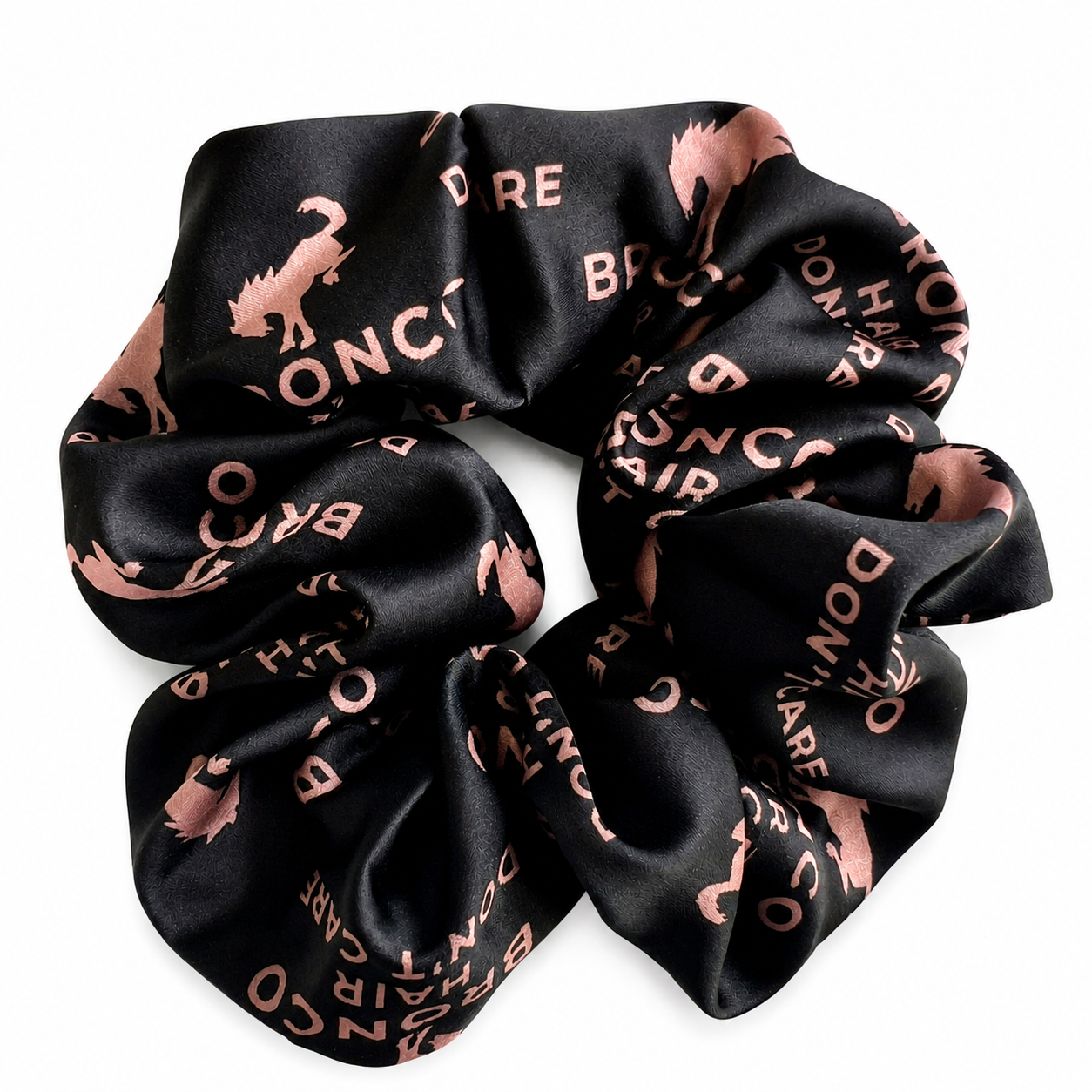 Women's black satin Bronco Hair Don't Care scrunchie with blush pink Bronco horse print.
