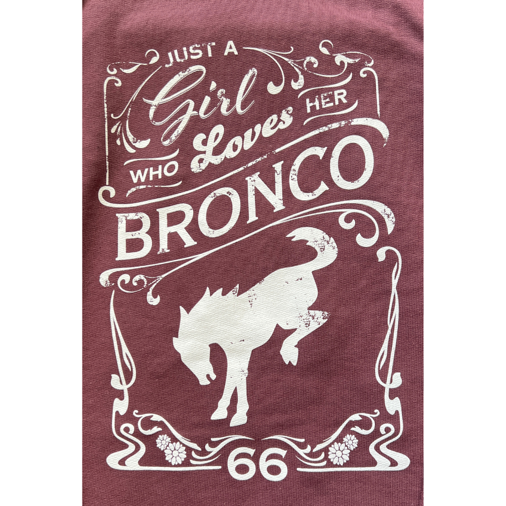 Close up "Just A Girl Who Loves Her Bronco" text printed on a port-colored lightweight loopback terry hooded pullover