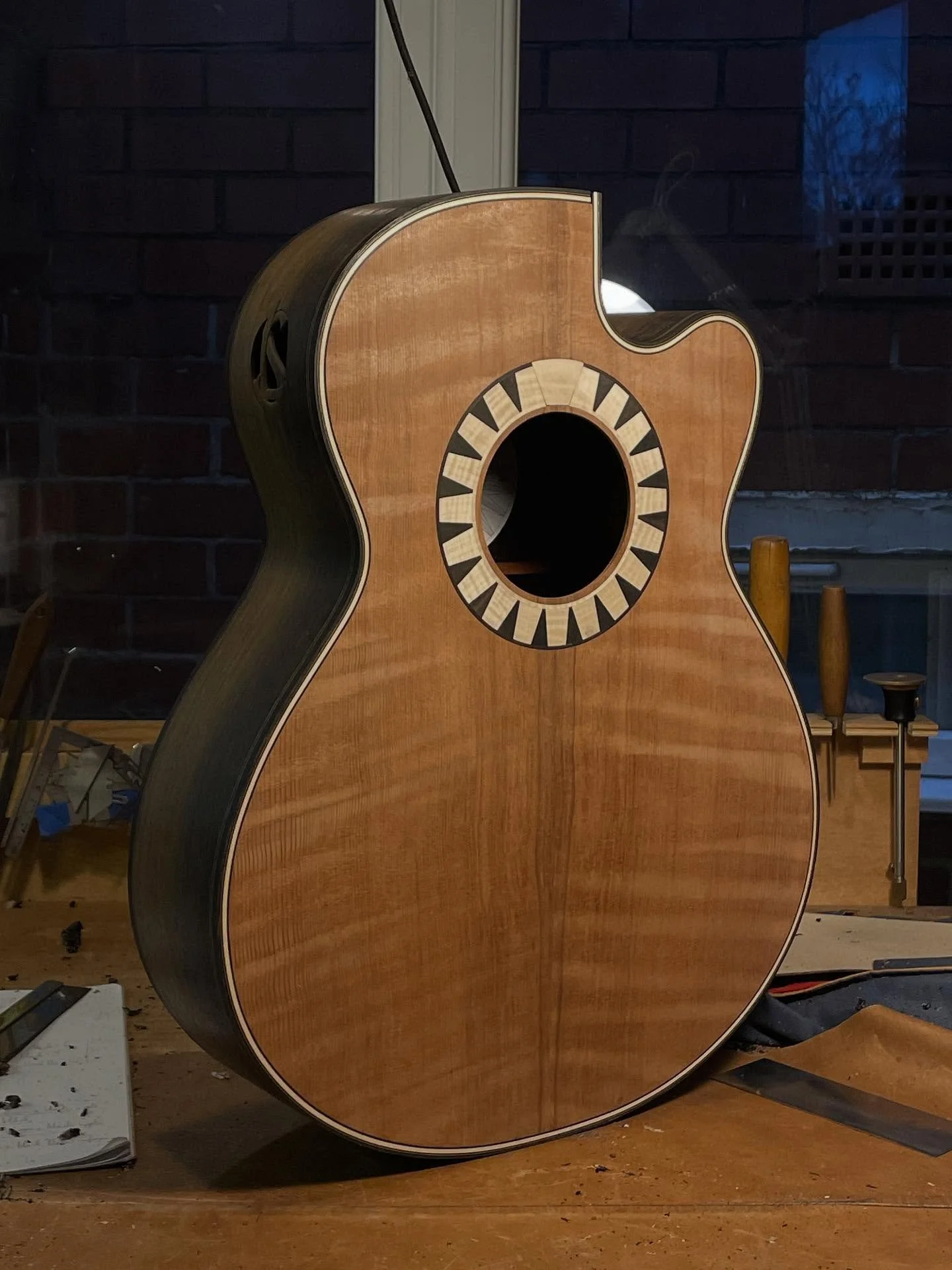 The two bodies of the acoustic guitars I&rsquo;m making are fully done now! Ended up with quite a striking contrast between the bog oak, flame maple purfling and dark redwood top 🔥