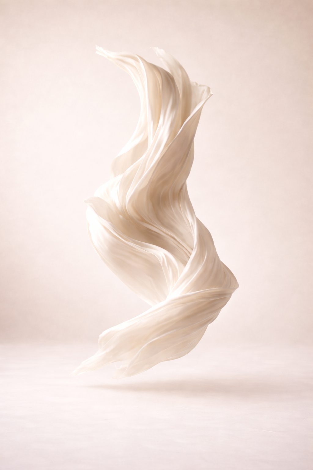 Abstract swirling white fabric or material against a light background.