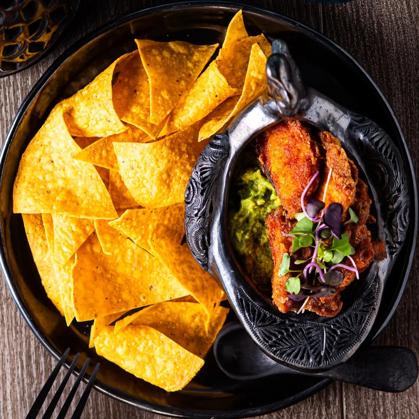 Our Totopos &amp; Guacamole don&rsquo;t start in a bag.
They start in the kitchen.

Everything begins with real corn, nixtamalized and prepared the traditional way. We make our tortillas from scratch, cut them and fry them fresh to create authentic t