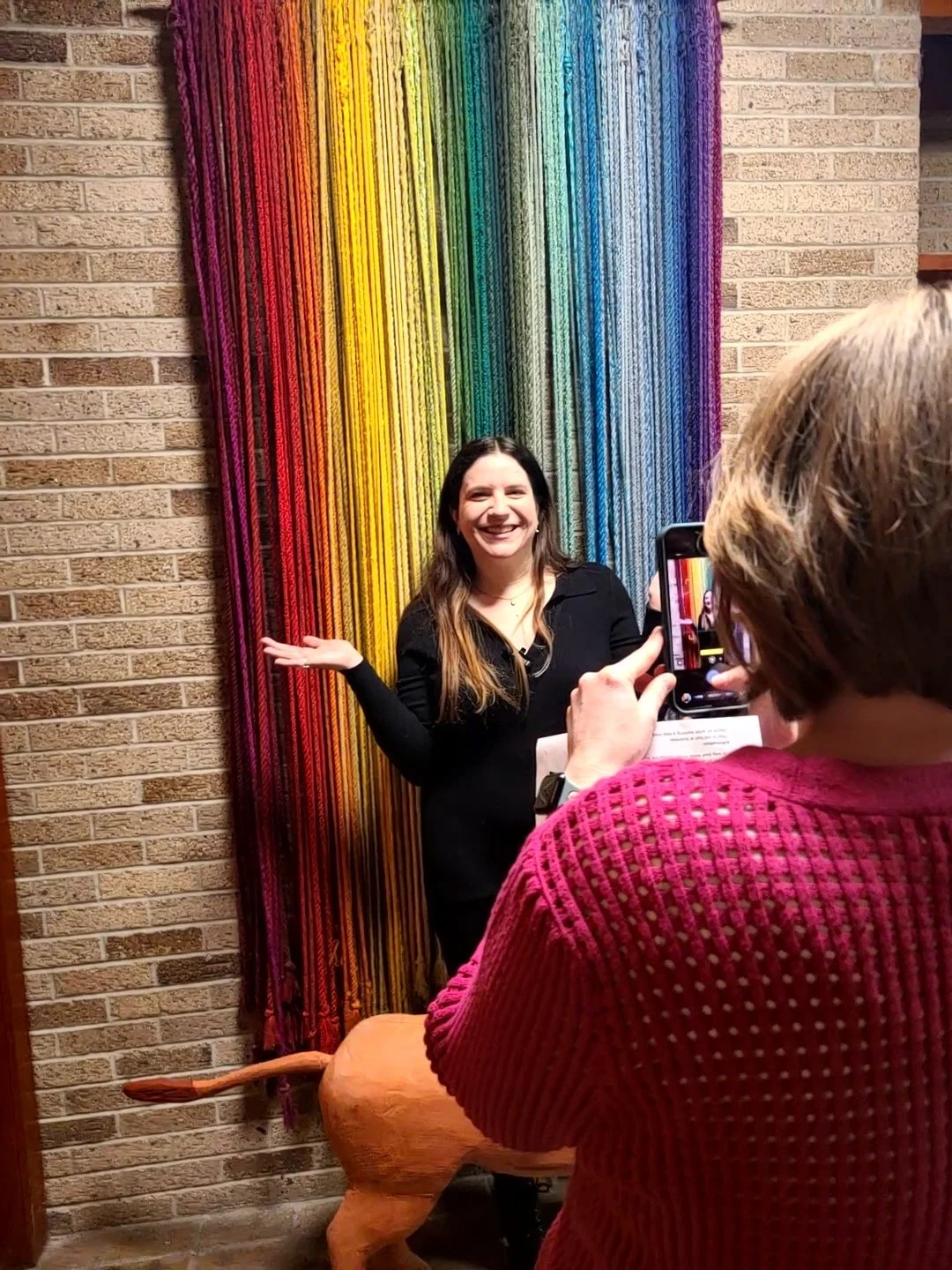 Kathleen Haney of Made Up Media collaborating with a client during a Mid Michigan business content creation session.