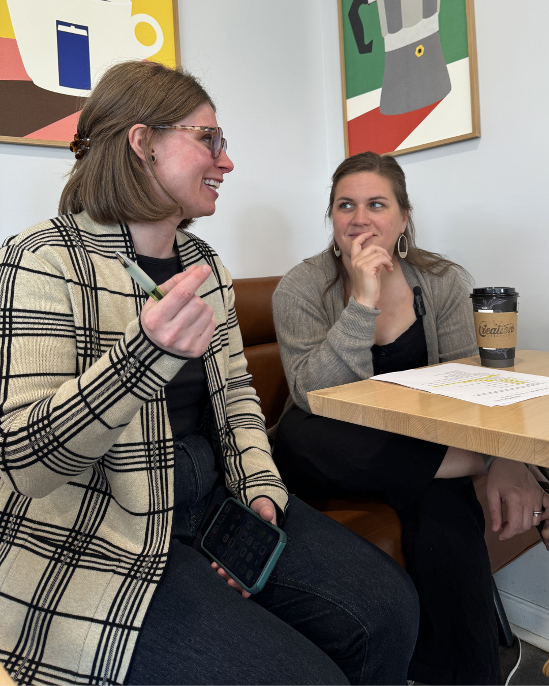 Kathleen Haney discussing small business marketing with a client during a consultation in Midland, MI.