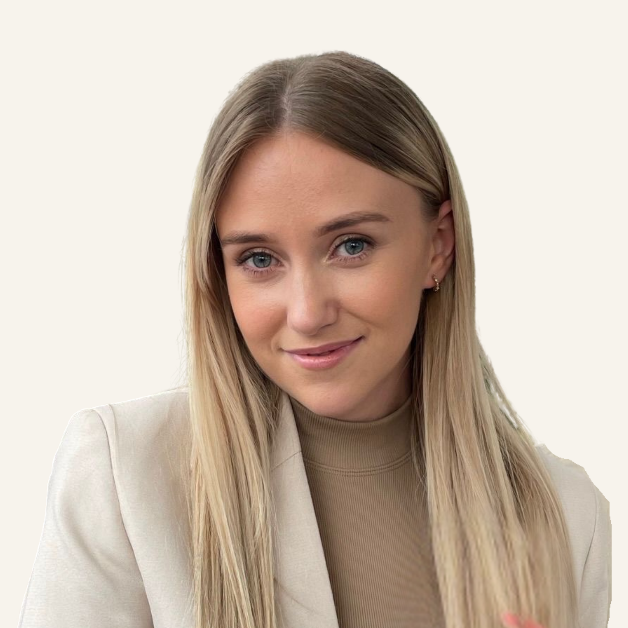 A man with curly dark hair, glasses, and a beard, wearing a dark green sweater, looking contemplatively to the side.