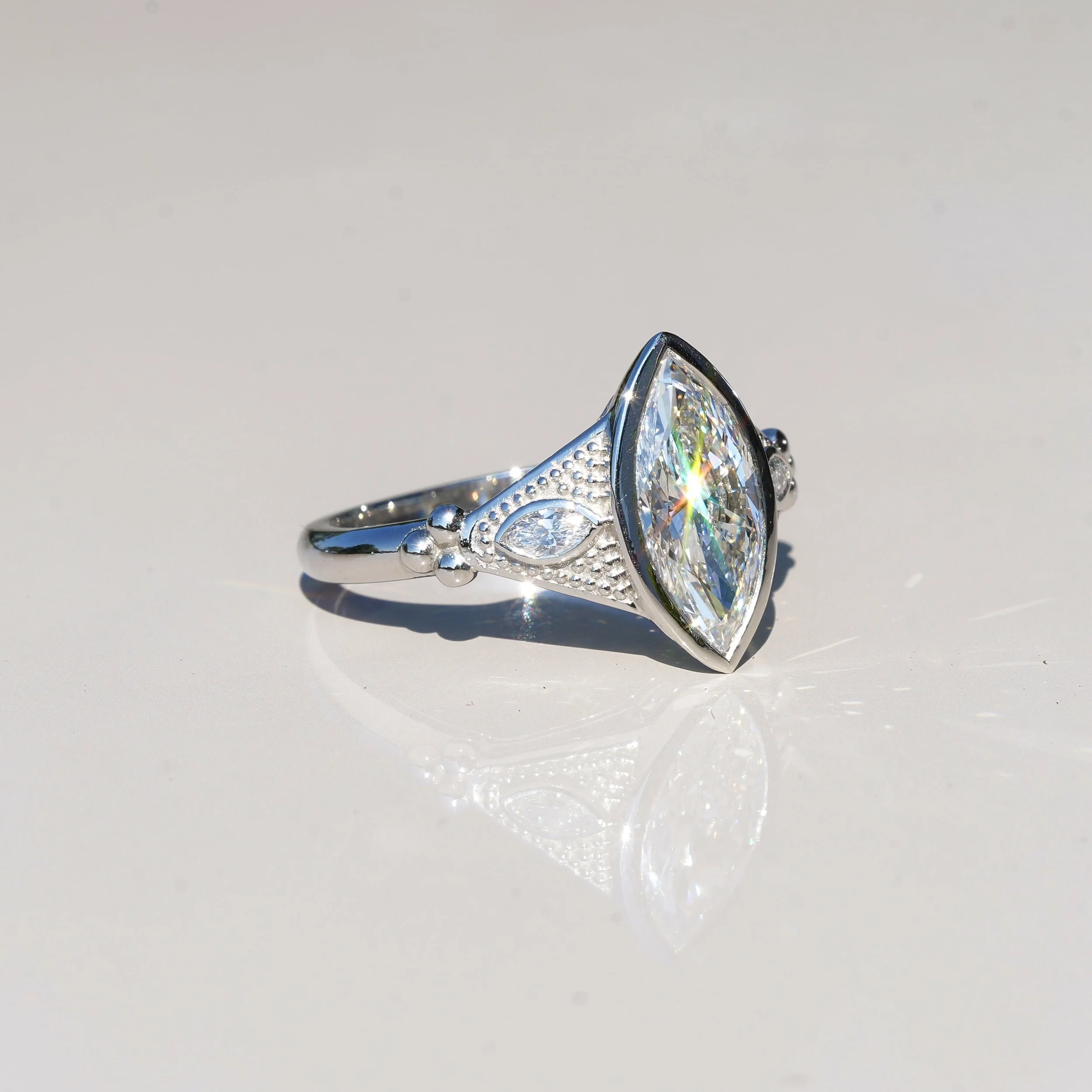 2ct Marquise Bezel Set Diamond Ring with Milgrain with two 0.1ct Side Stones in Platinum, Total 2.2ct – Back View | Eighty8Diamonds