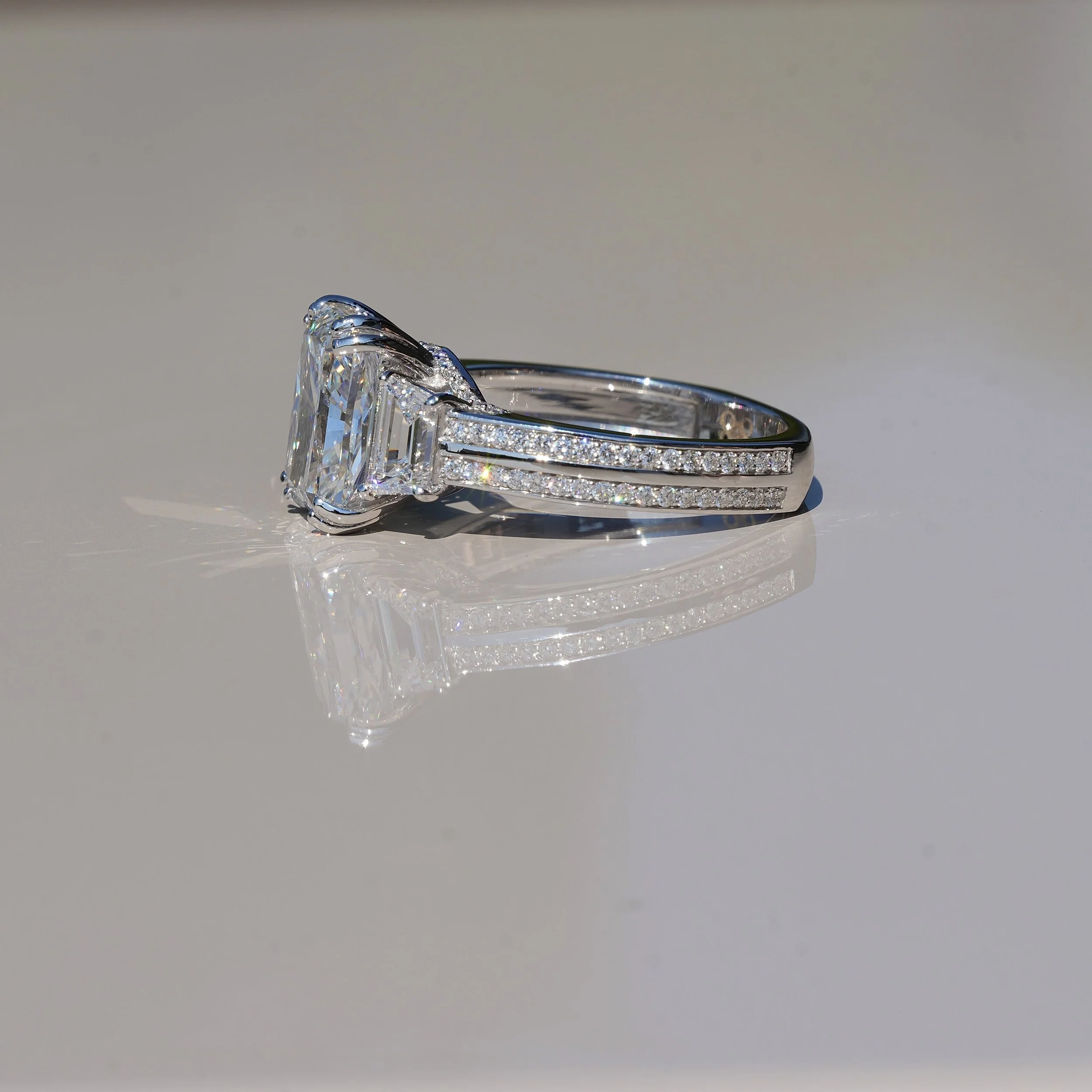 4ct Radiant Cut Diamond Engagement Ring with 3D Diamond Band and Trapezoid Side Stones in 18ct White Gold – Angeled Angle | Eighty8Diamonds