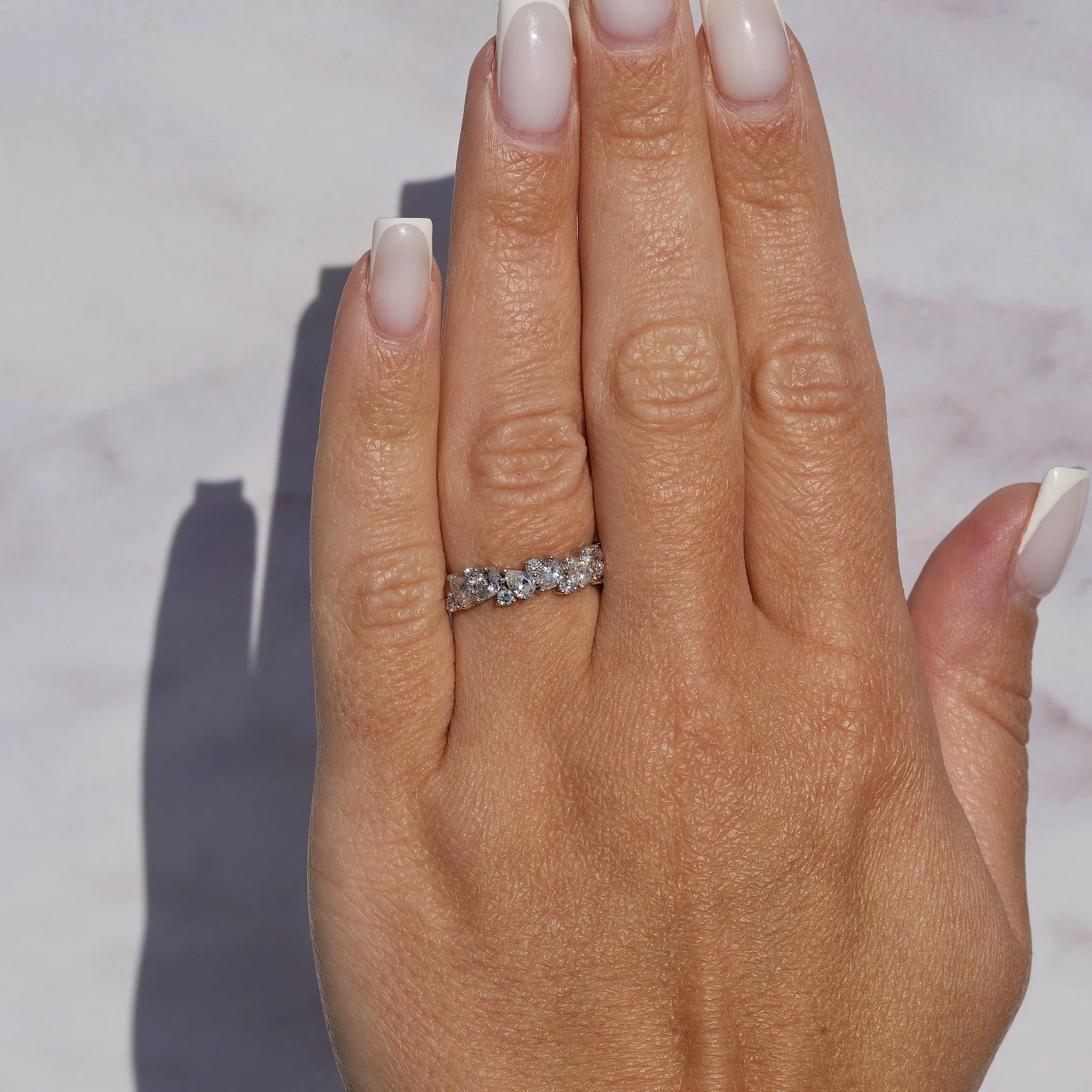 Half Eternity Wedding Ring with Pear and Round Cut Diamonds in Platinum, Total Carat Weight 1.45ct – Hand View | Eighty8Diamonds